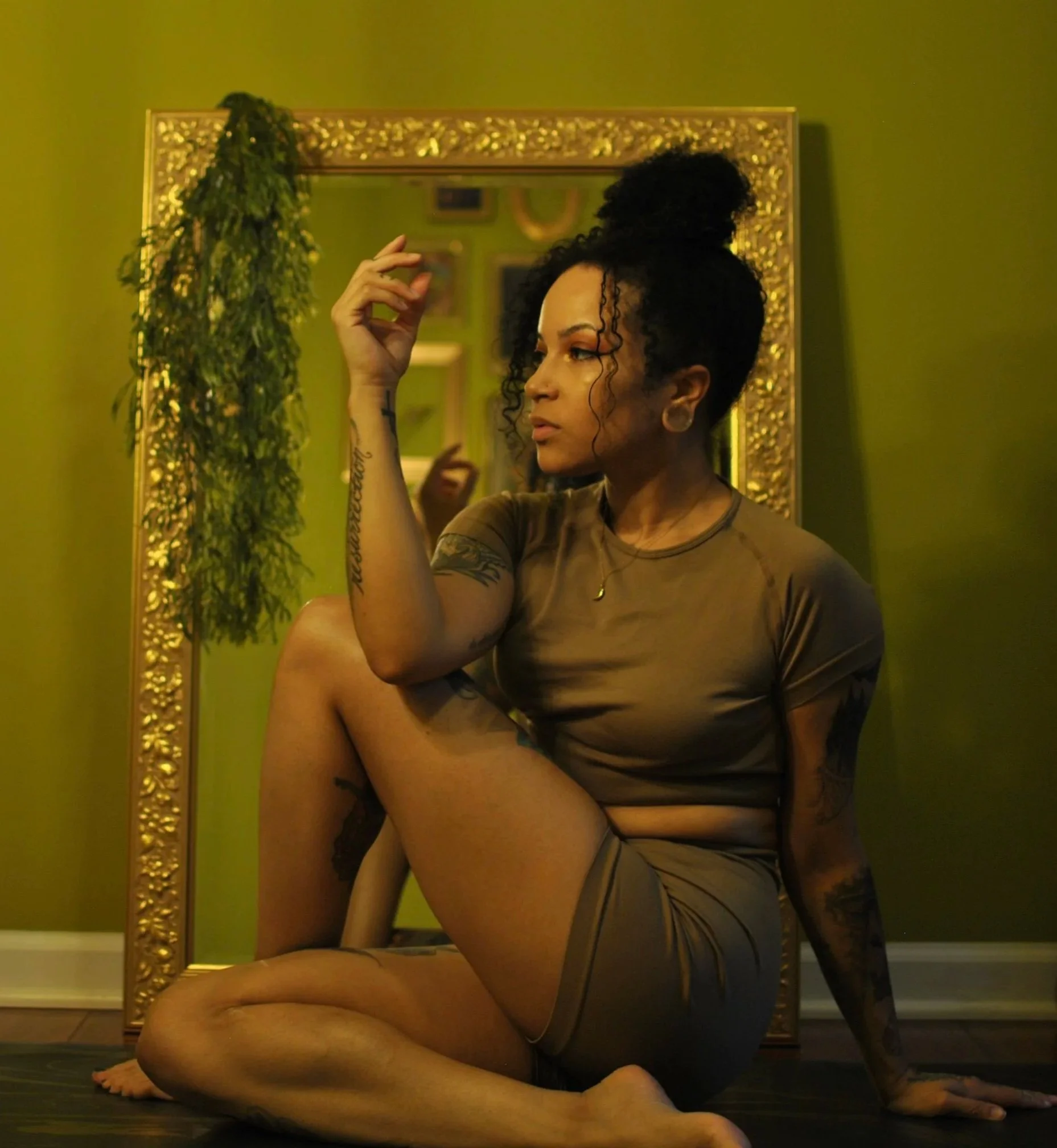 self portrait sitting in vajrasana, thunderbolt pose in yoga. i am a certified yoga instructor recognized by yoga alliance, taught at sankofa in laurel Maryland. my style of yoga is restorative, nurturing, and inspired by the natural and cosmic world