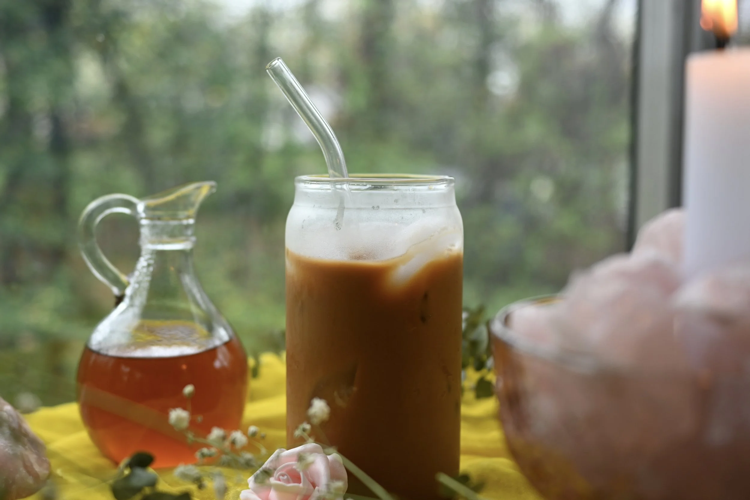 an iced lavender-rose latte for springtime. this post includes the magickal correspondences for each ingredient of this seasonal, witchy recipe.