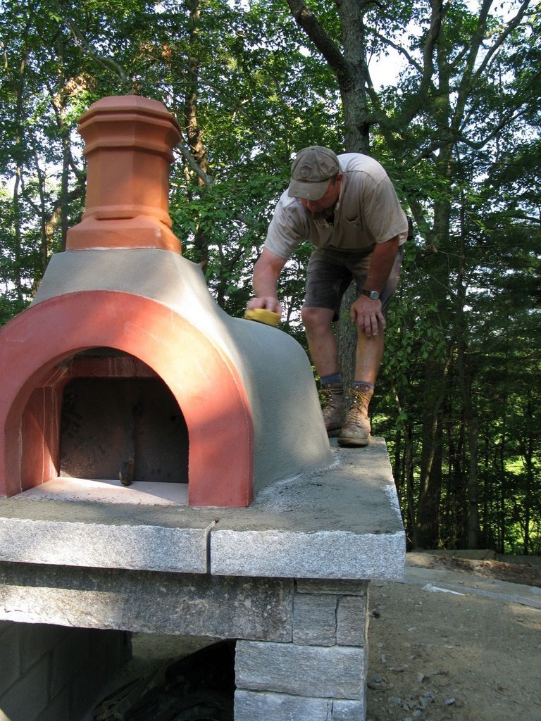 John applies a final thin coat to seal the dome.