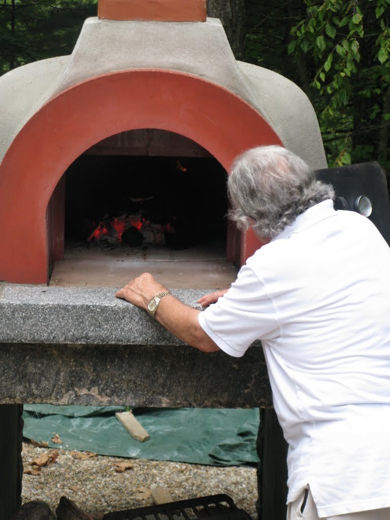 Inspecting the oven during the first firing.