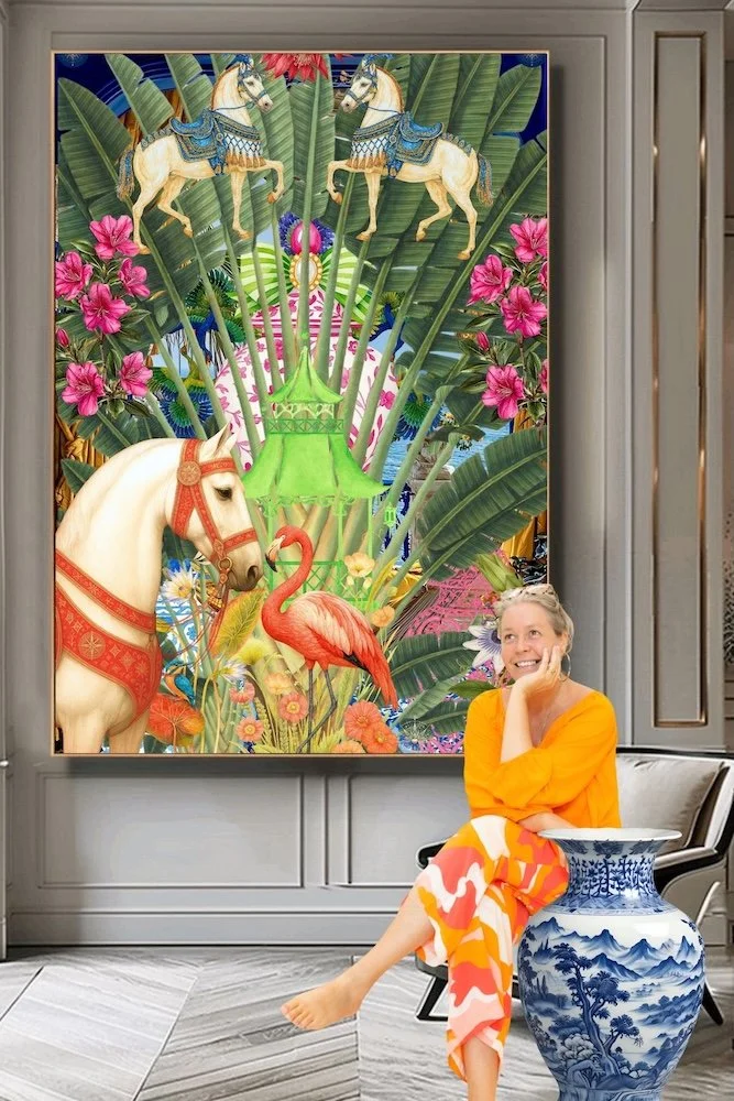  Anastasia Kaesbach sitting in a modern room with a vibrant, colorful painting by Anastasia Kaesbach of tropical jungle scenery behind her. 