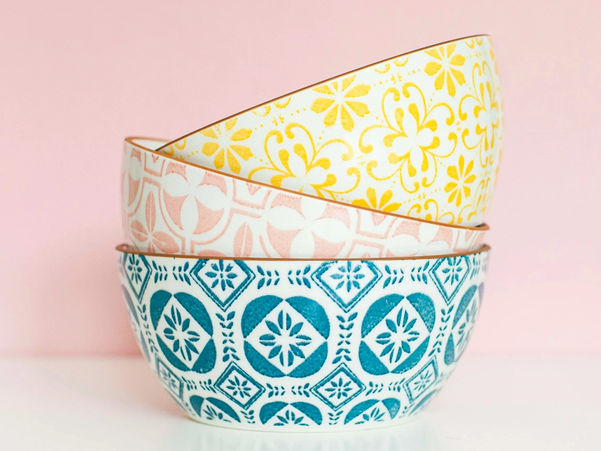 image of different colored bowls stacked crookedly