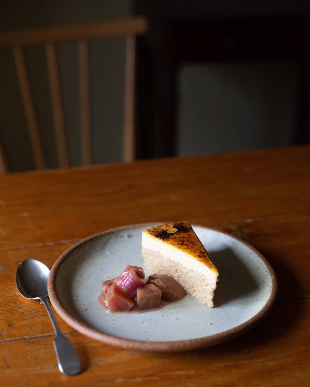 Baked rice custard and poached rhubarb. Inspired by a Tuscan favourite called Torte di Riso. Each bite is reminiscent of Cr&egrave;me Caramel and rice pudding at the same time. A fine combination indeed. Rhubarb picked from a very friendly neighbour.