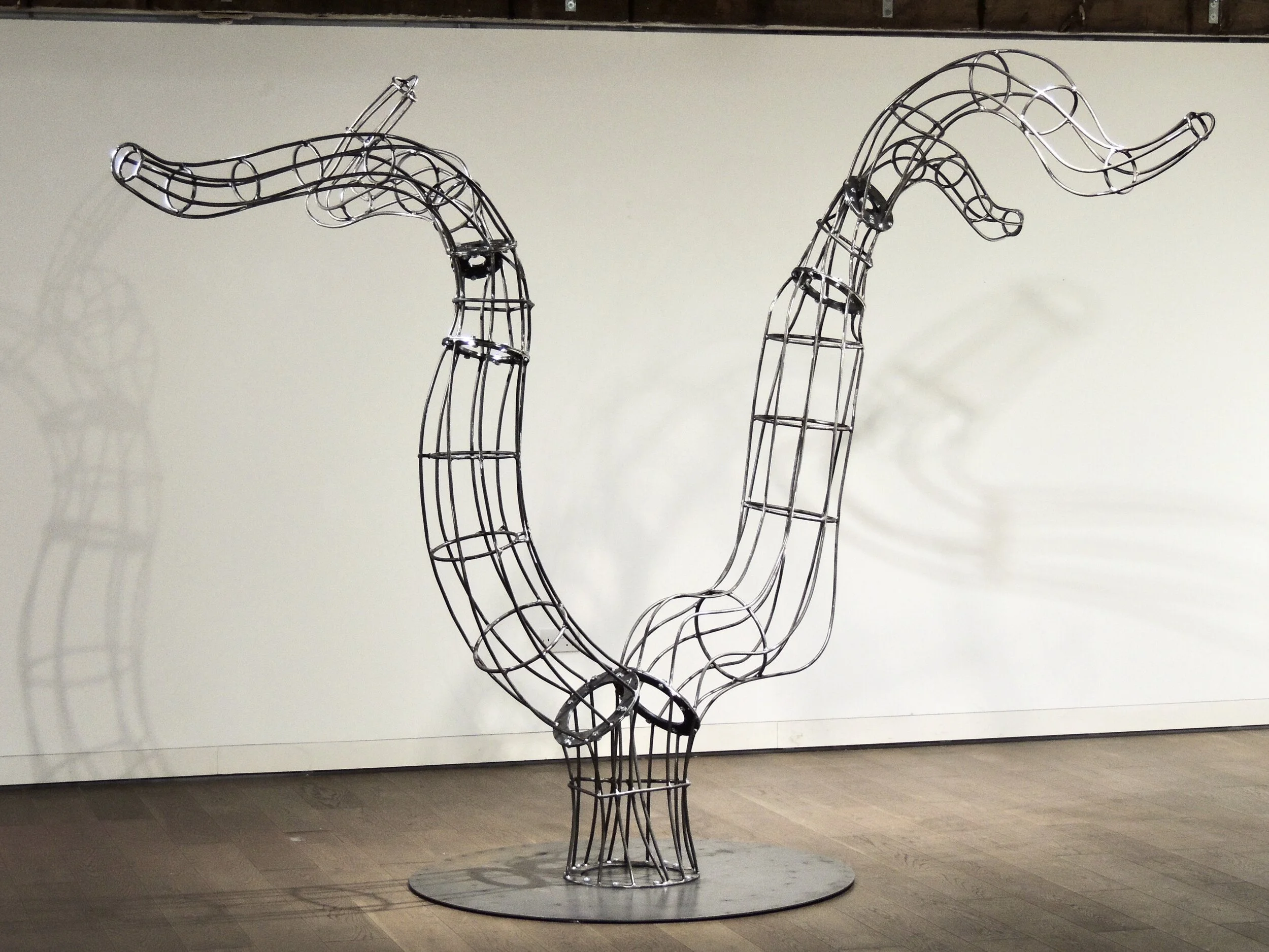 Willow Tree (2020)Steel. 3 meters x 2.5 meters x 2.5 metersWith winding branches designed to bear the weight of a person, Willow Tree symbolizes the balance between individuality and community. A singular tree grows with the support of a larger syst…