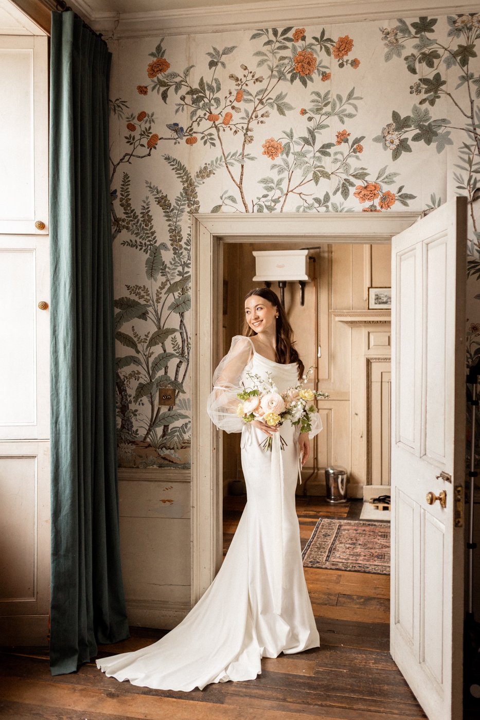 Bride stands in the doorway 