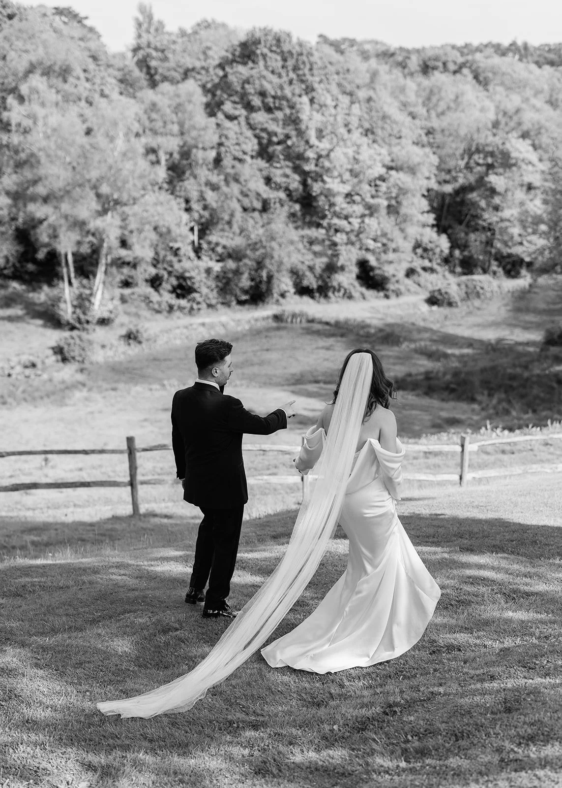 Black and white Photo of the Bride and Groom walking in the Gardens at The Beacon in Tunbridge Wells