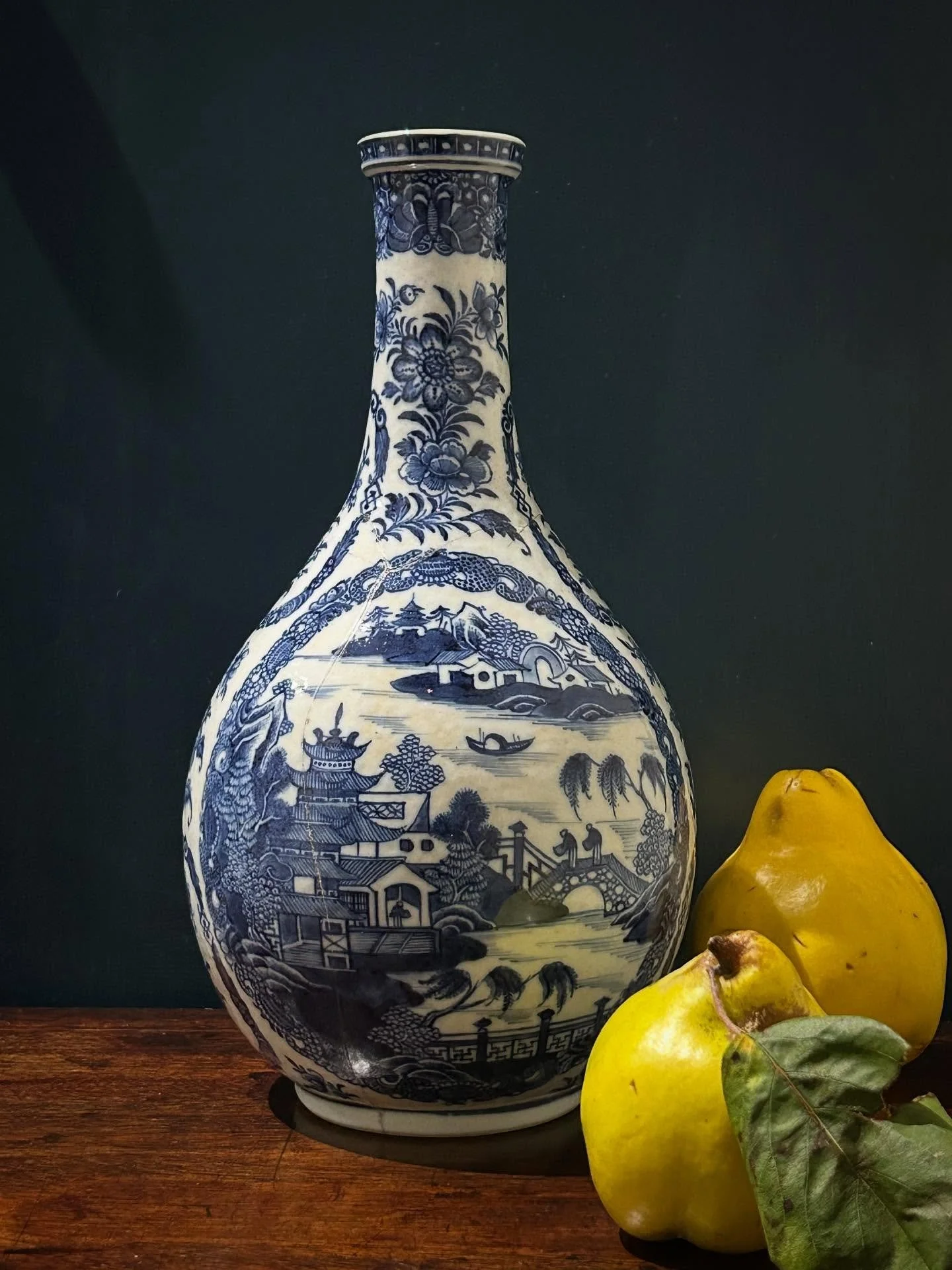 Beautiful 18th century Chinese Qianlong period blue and white bottle vase. Hand painted in a style that influenced early English Spode. 
Historical restoration (has been in four pieces) 
Stable. Displays very well! 
Globular body approximately 14cm w