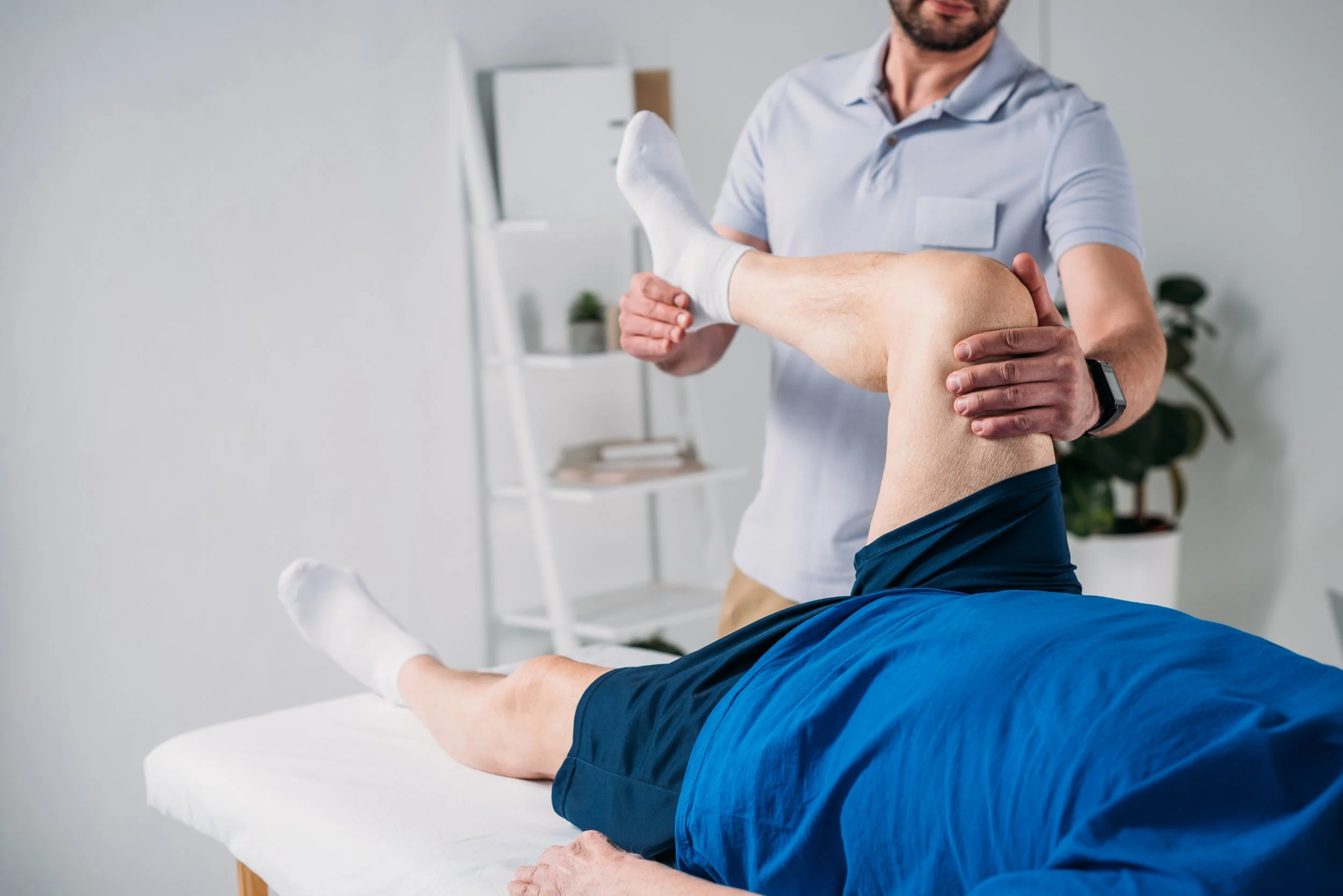 partial-view-of-rehabilitation-therapist-massaging-2021-08-29-21-07-45-utc.jpg