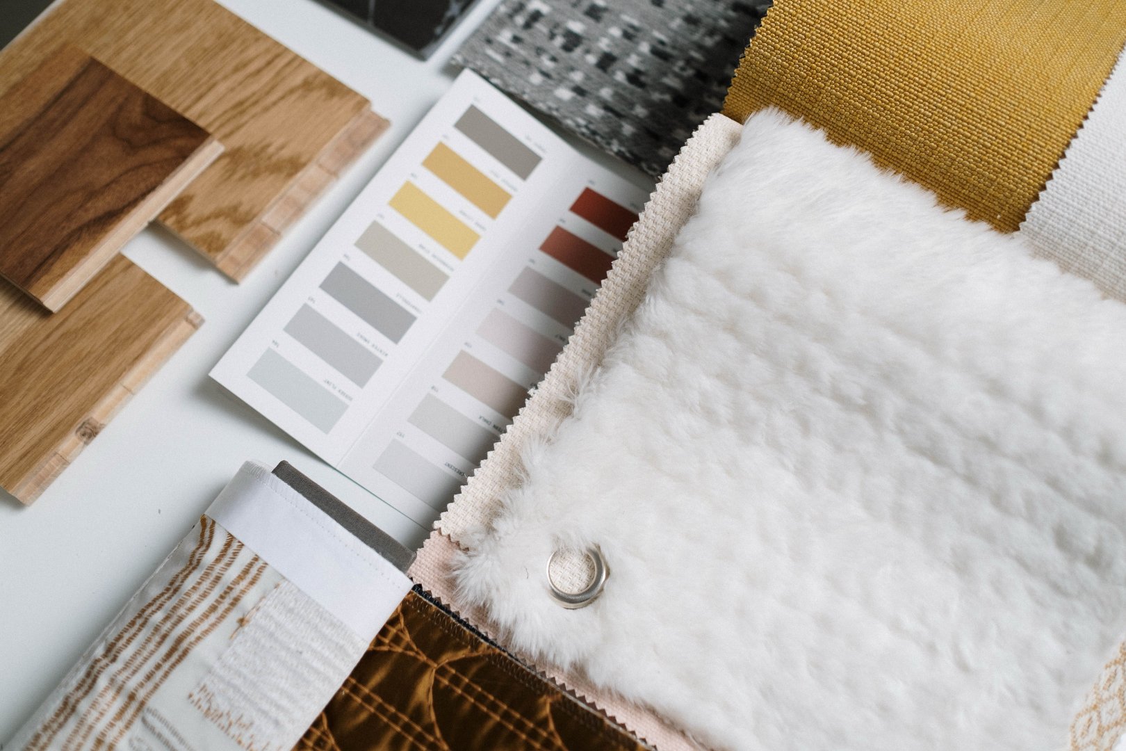 Interior design material samples including fabric, tile, and finish selections