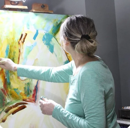 Laurie Pace midway through a horse painting in her studio