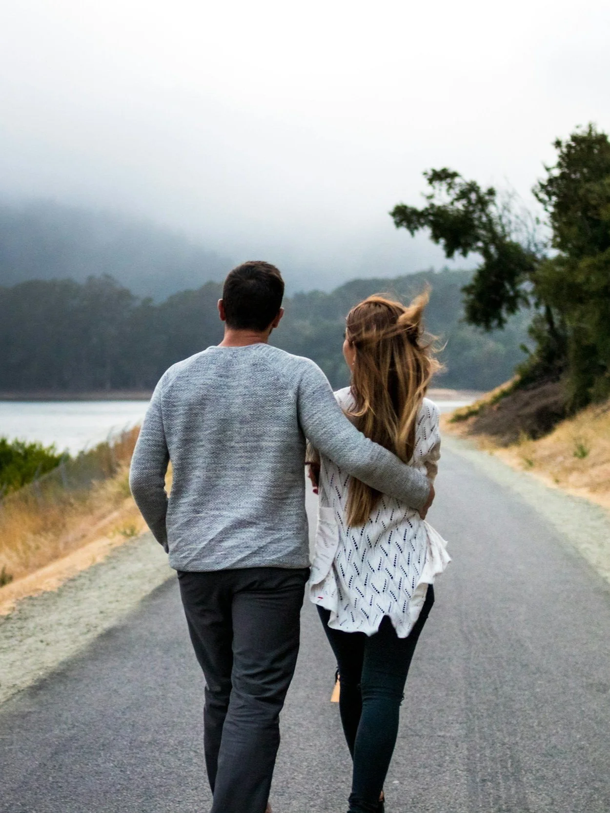 couple walking outside on a path
