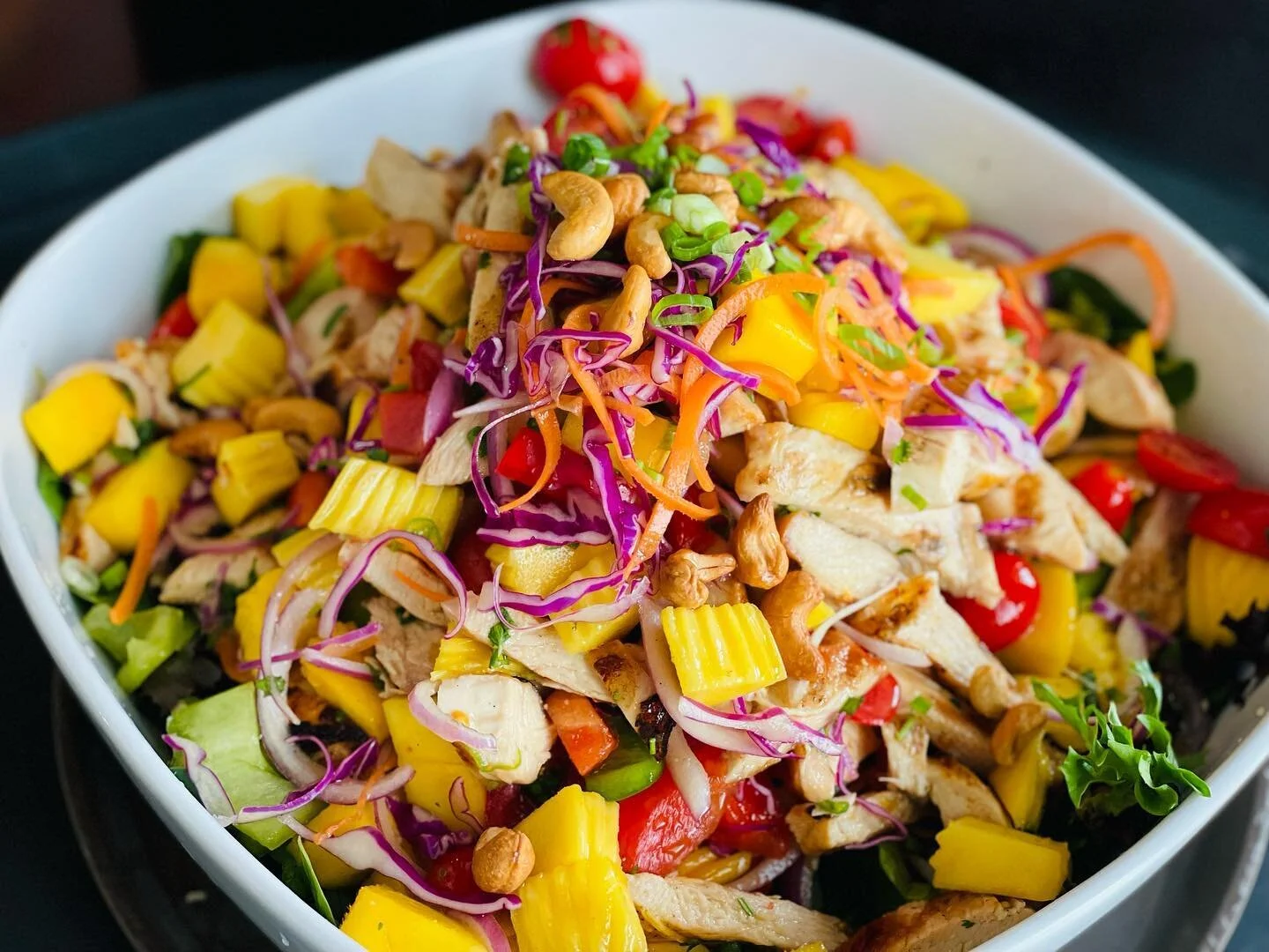 Mango Salad: Chunks of sweet mango, with red onion, bell peppers, tomato, and cashews.