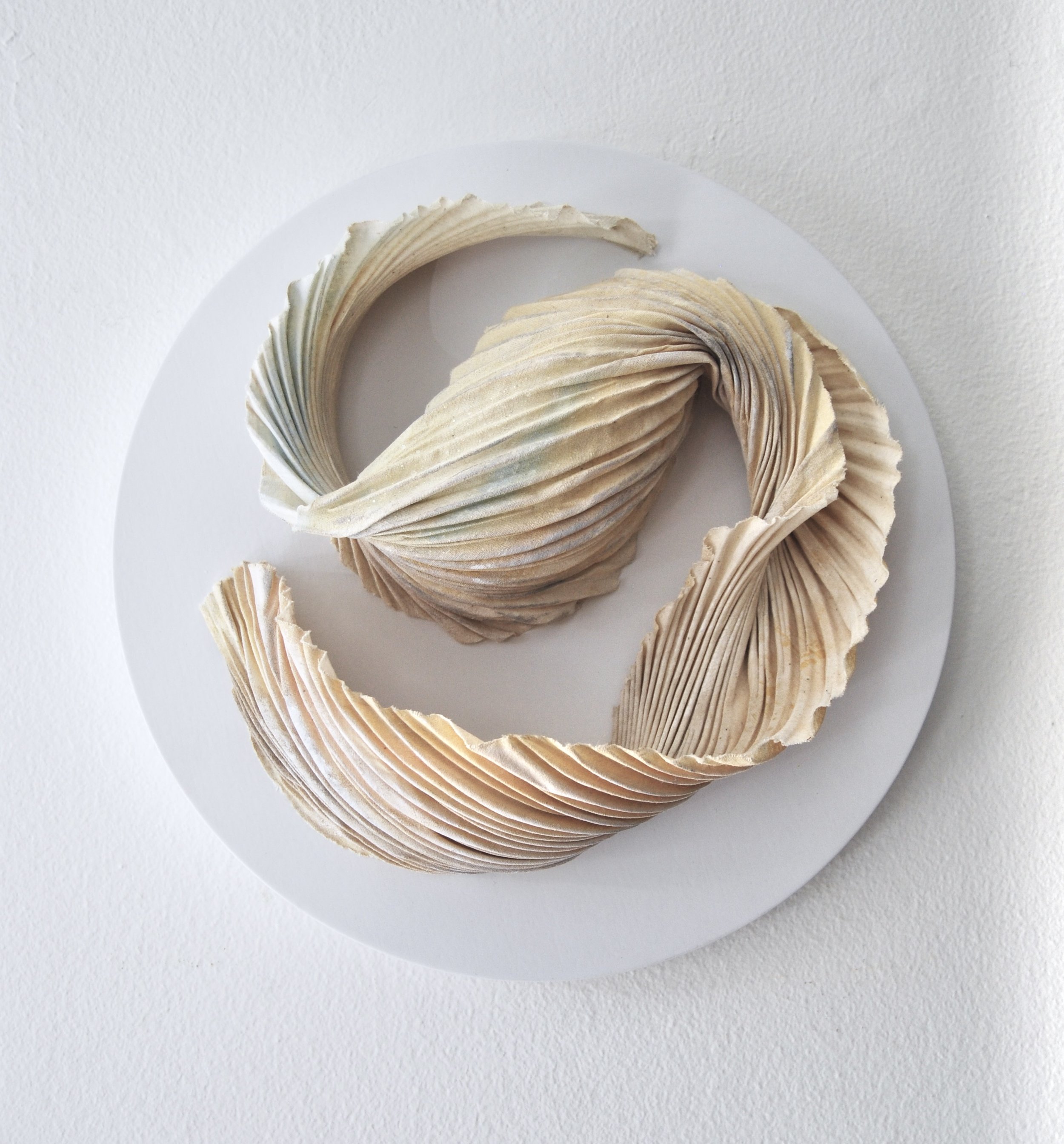 Embrace /
10" Diameter, 4" D /
Arashi Shibori Pleated Muslin, Acrylic Paint, Archival Adhesive, Wood (2023) / Inquire for pricing