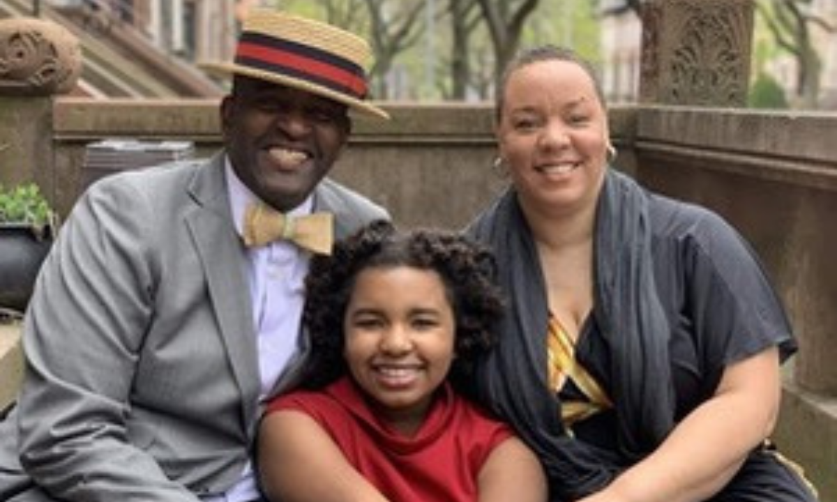 A smiling family of three — Lloyd, MacLemore, and her mother — posed together outdoors. MacLemore Porter is a HOPE Accounts beneficiary who lost her father Lloyd to Covid-19