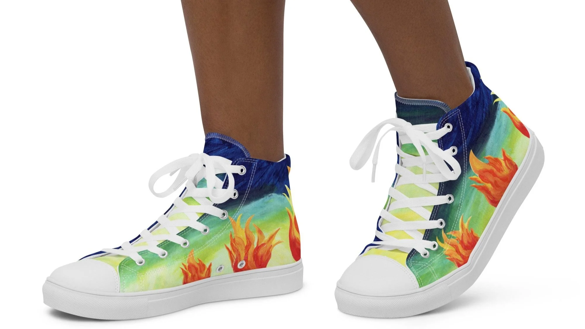 Person wearing high-top sneakers with flame and green gradient design and white soles.