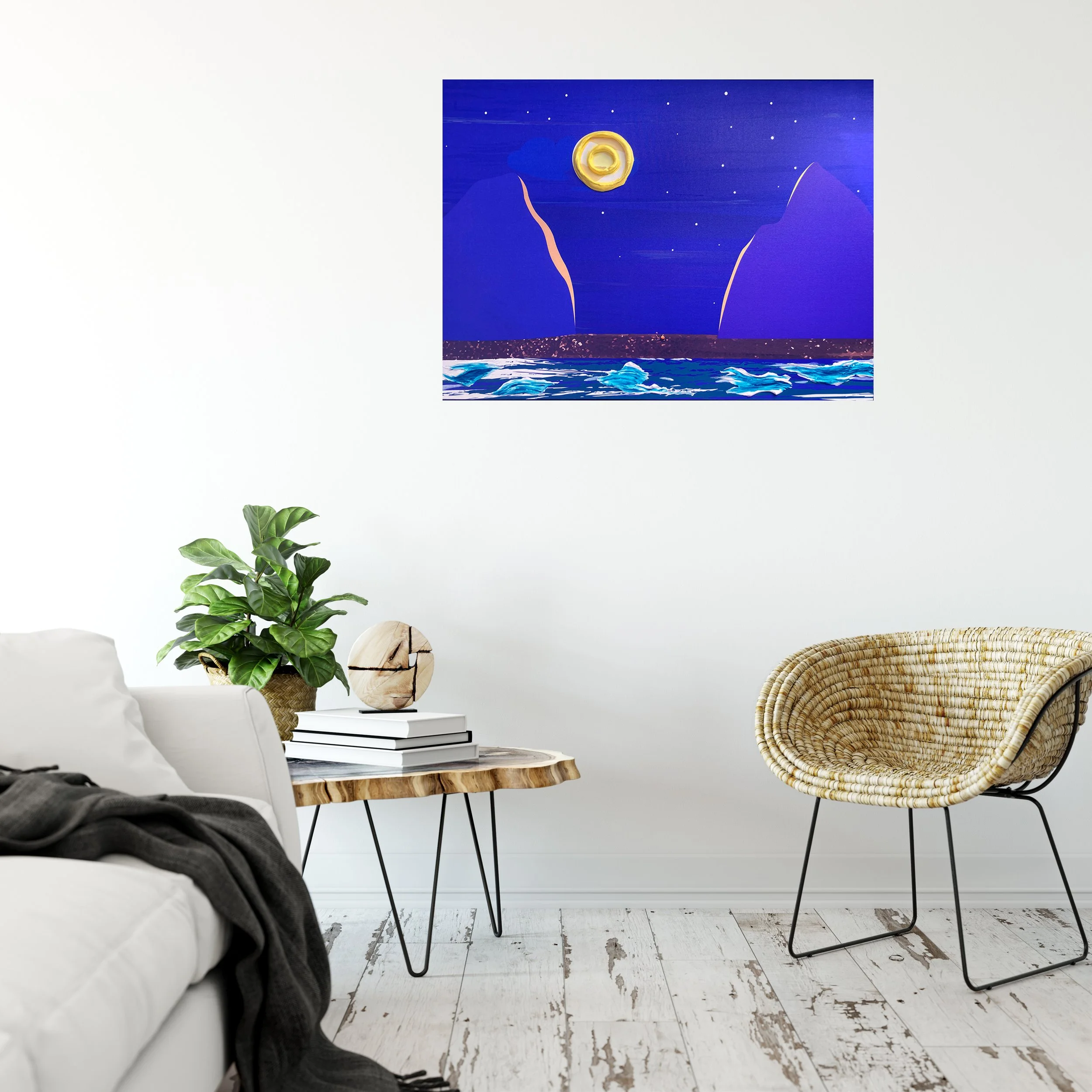 Modern living room with white couch, a small wooden table holding a potted plant, a stack of books, and a decorative ball. There is a woven chair with metal legs, and a colorful abstract painting of a moonlit scene on the wall.