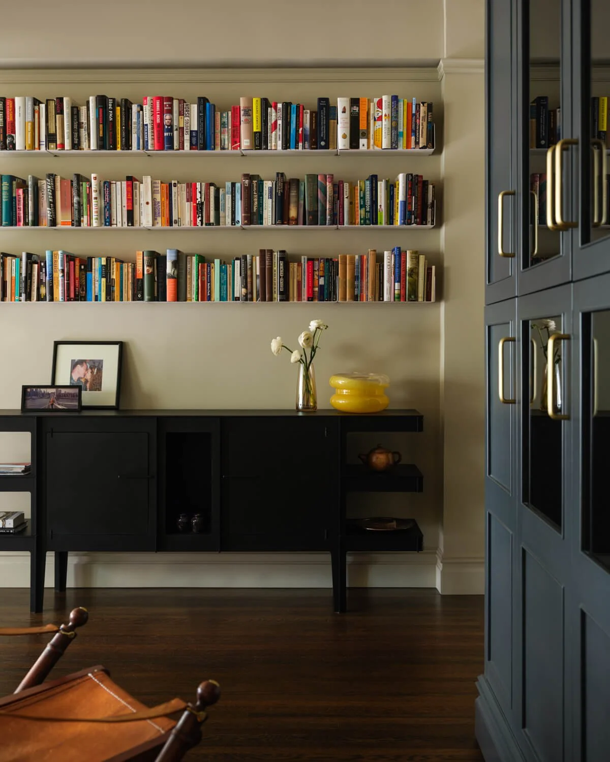 Custom built-in foyer storage concealed with manila hemp wall covering, Park Avenue co-op renovation