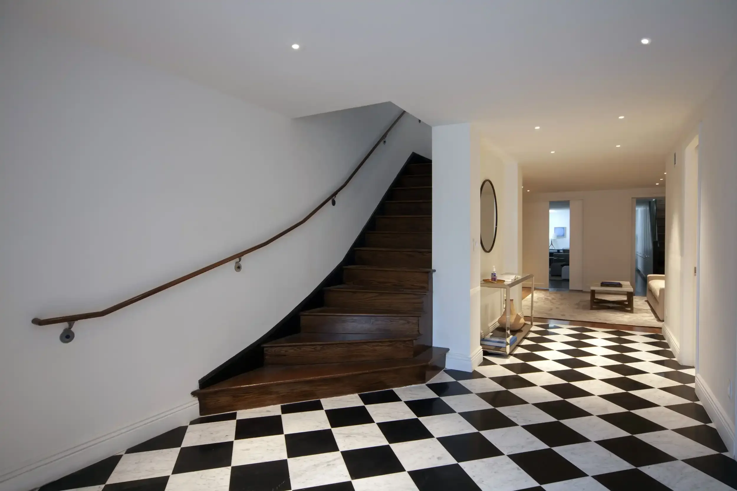 modern designed checkered floor and wood staircase in home