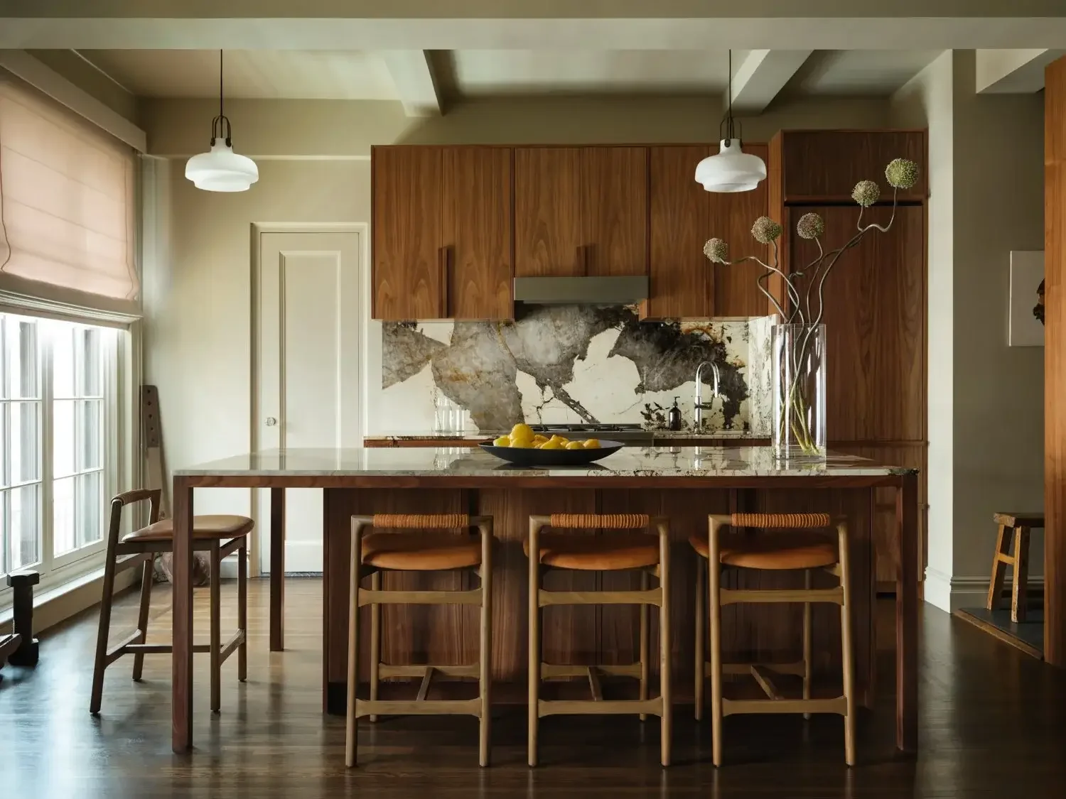 Wood stools at granite counter in kitchen