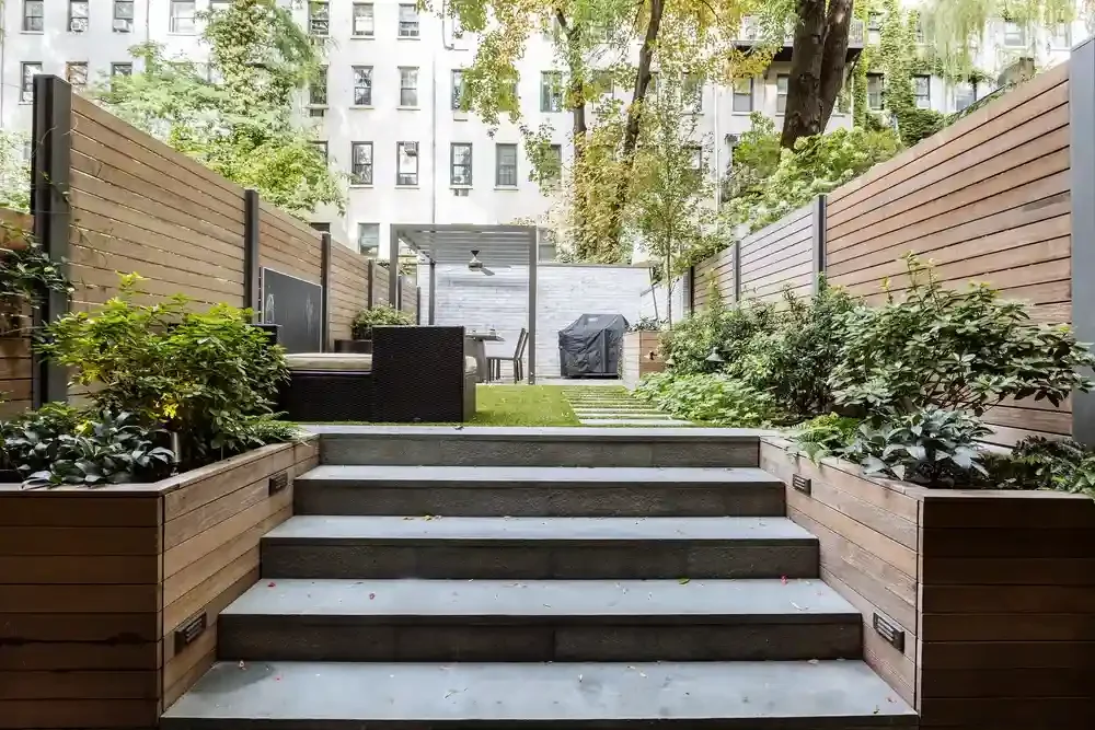 Chelsea NYC garden level apartment landscaping and exterior lighting