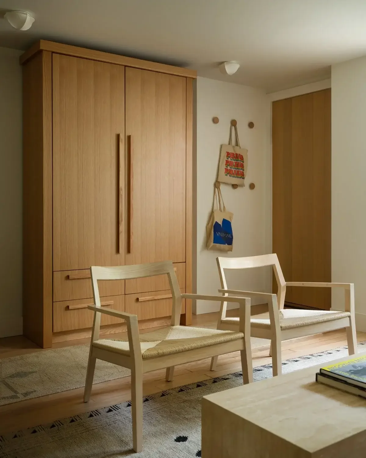 Wooden accent chairs in modern, warm living room