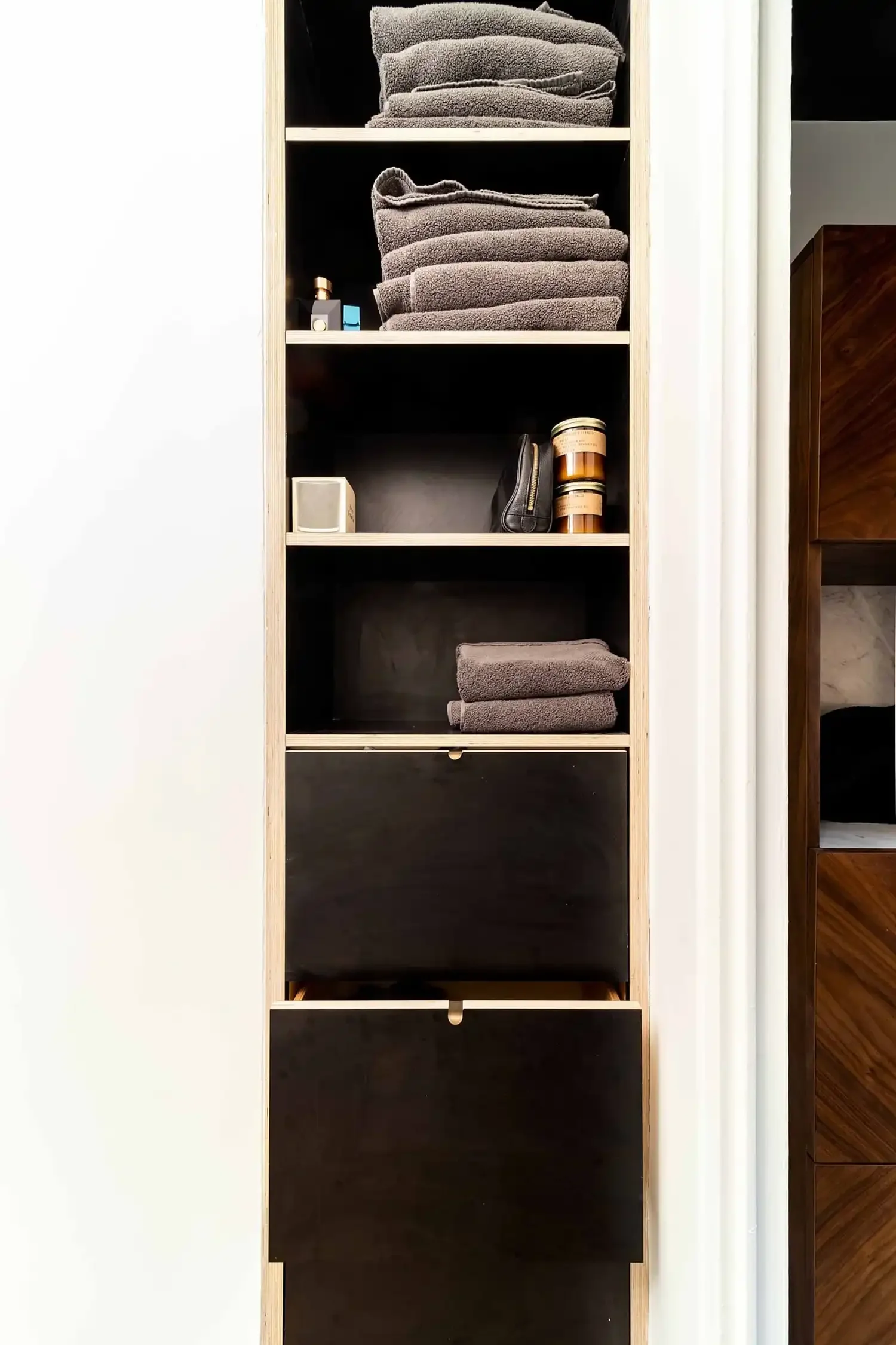 Custom millwork shelves and drawers from a full-scale renovation of a studio in Manhattan's Gramercy neighborhood