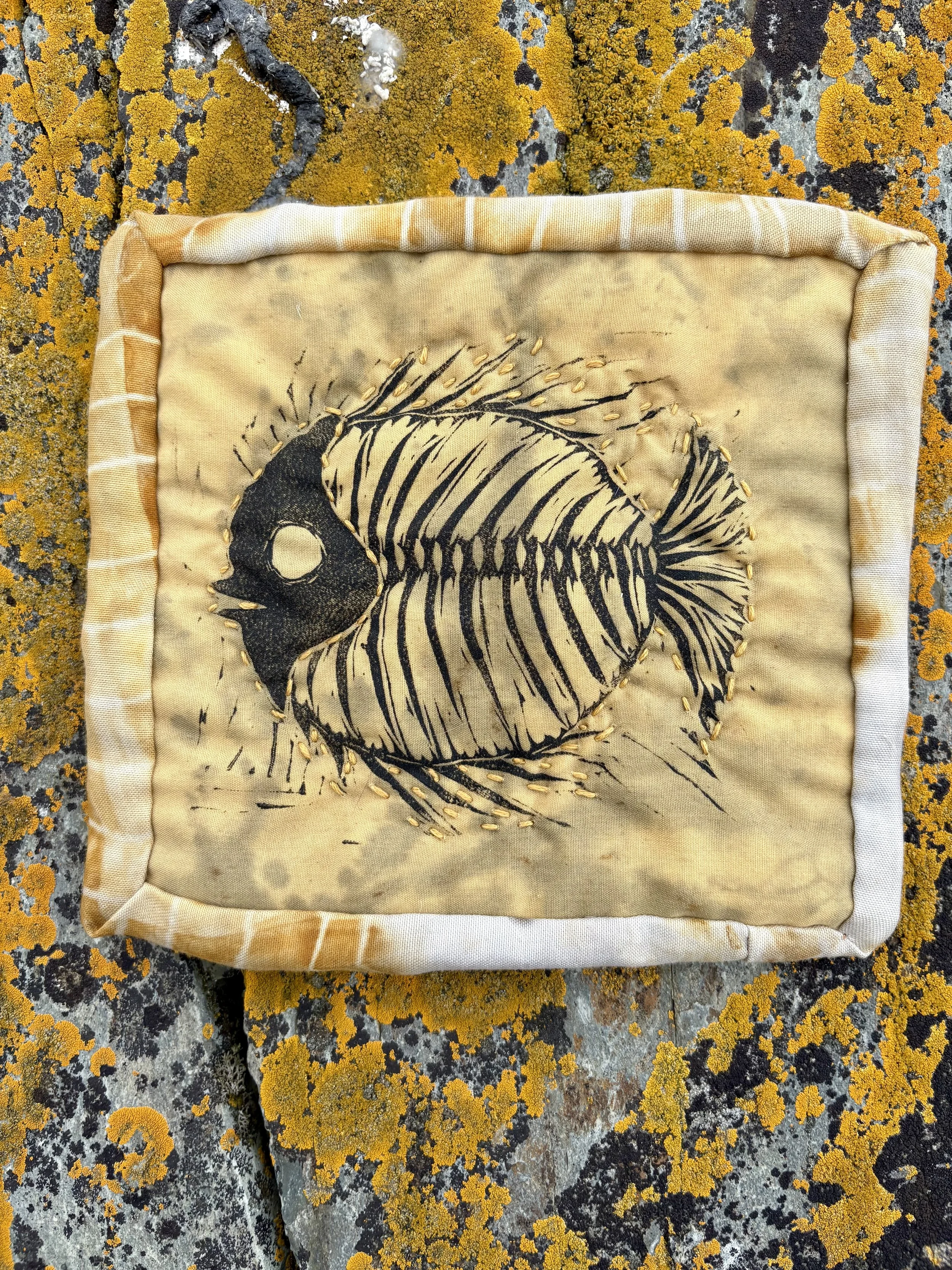 "Fossil Fish," linocut print on rust-printed miniature quilt