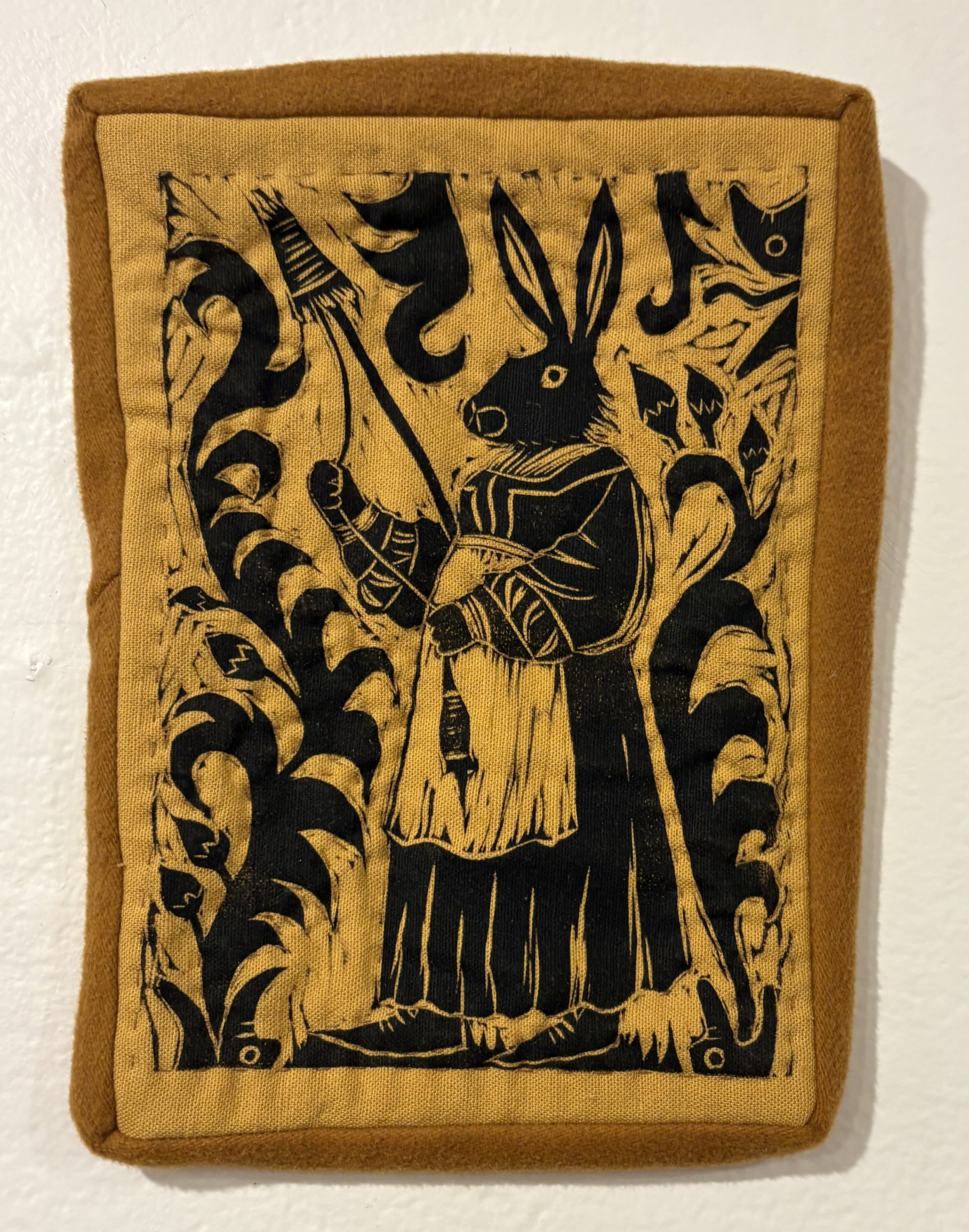 "Spinning Hare," linocut print on miniature quilt