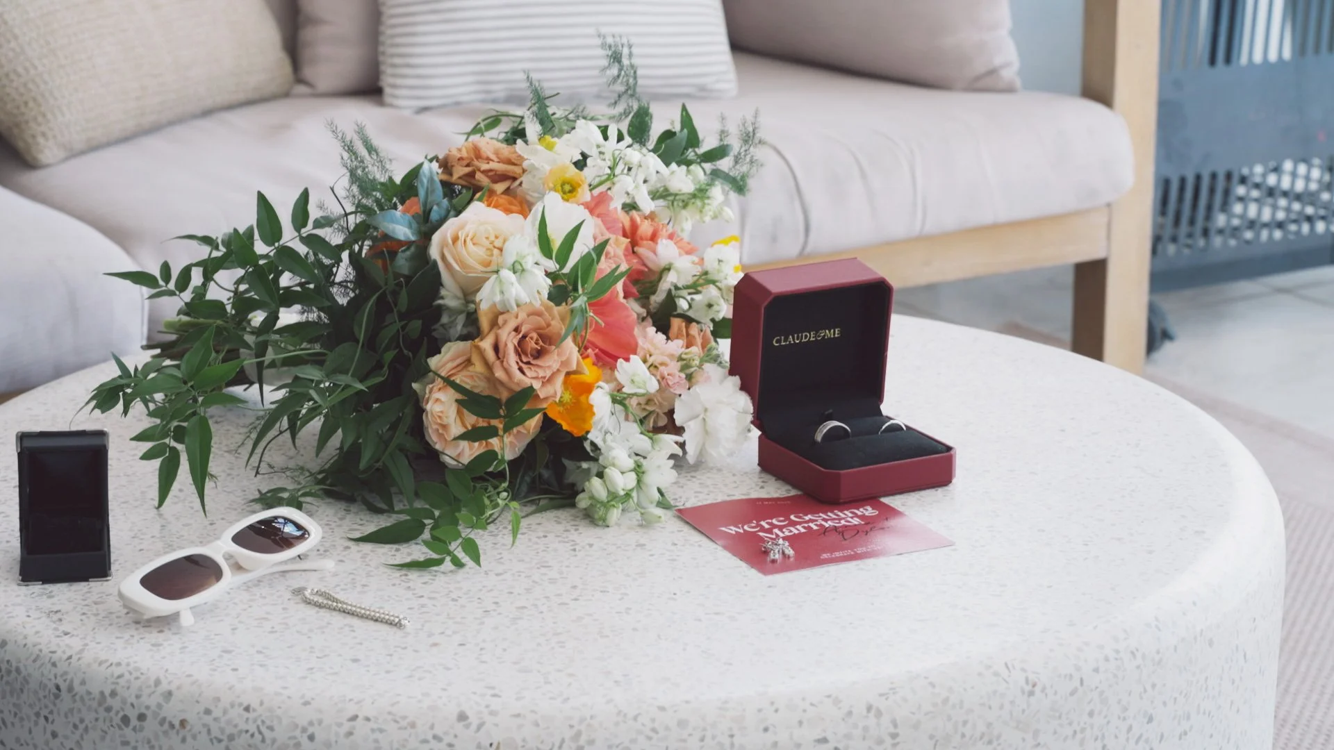 wedding flowers on table with wedding rings flat lay.jpg