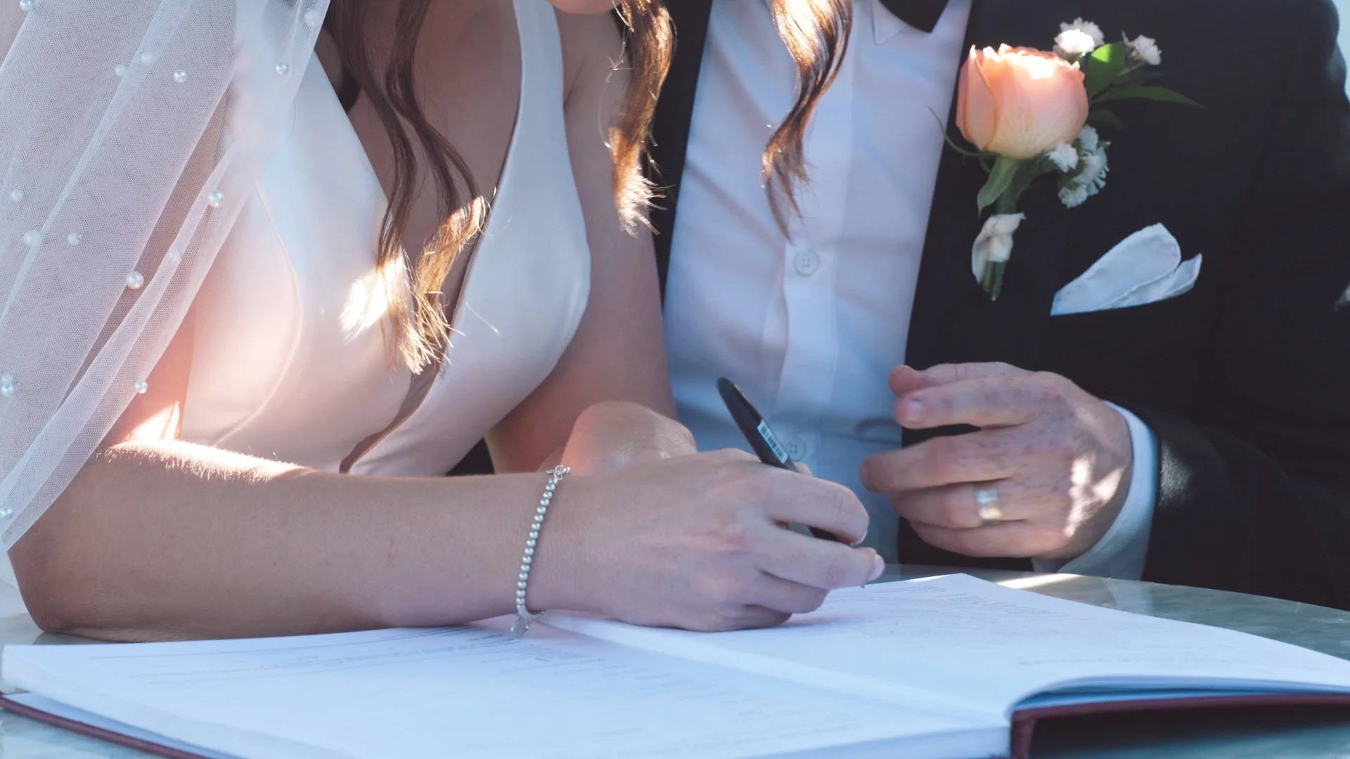 nride and groom signing registry.jpg