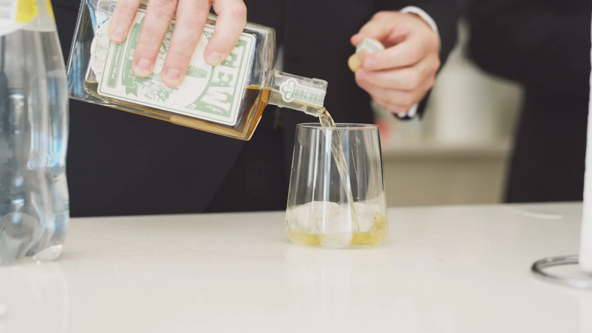 groom pouring a drink .jpg
