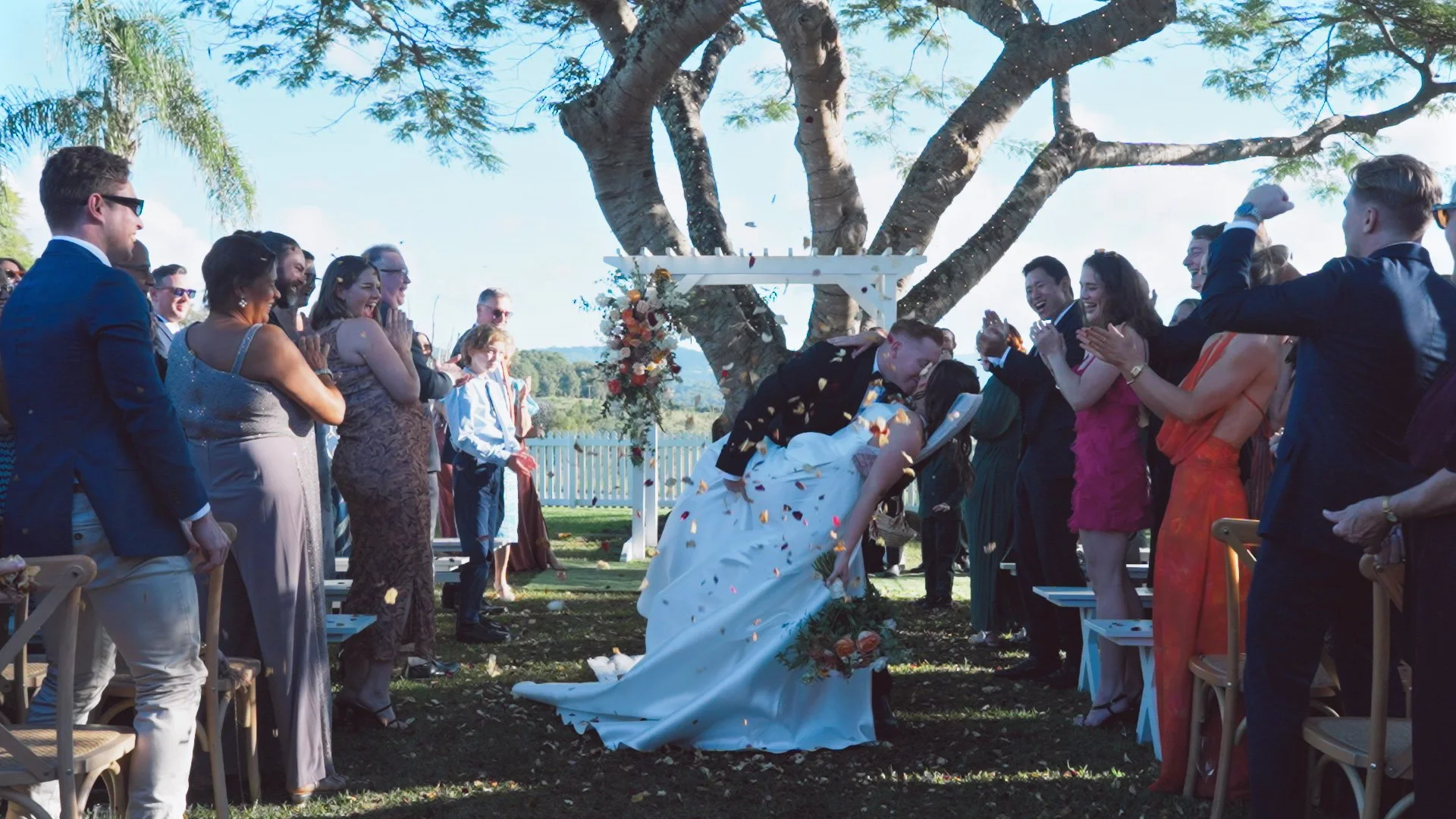 bride and groom kissing in the aisle.jpg