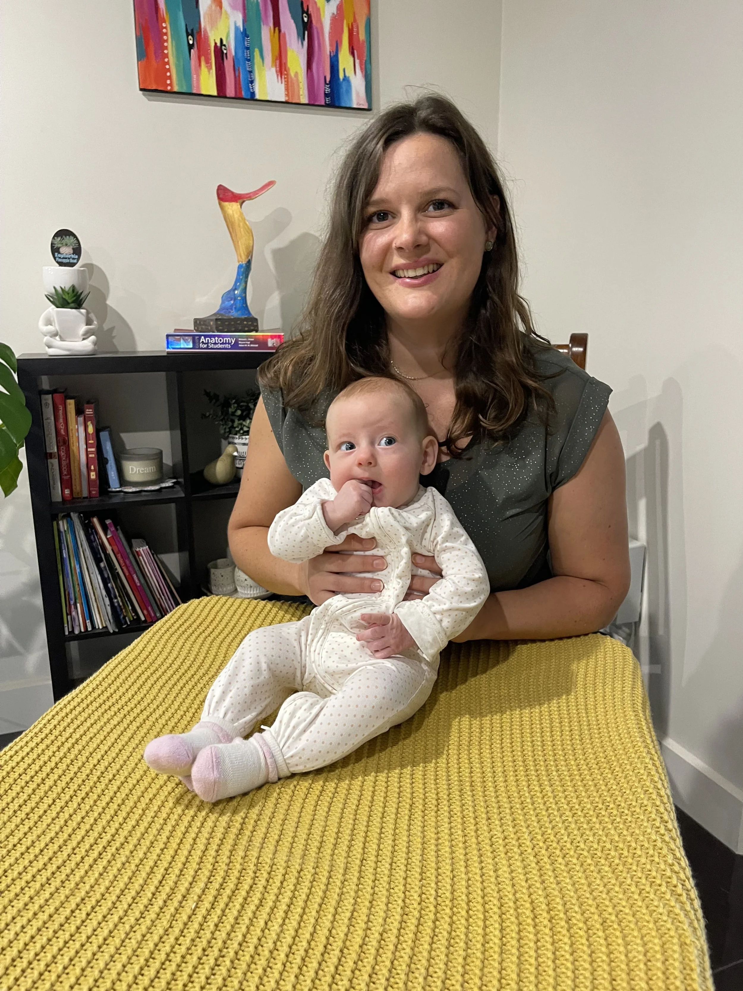 Osteopath treating baby in brisbane plagiocephaly flat head torticollis