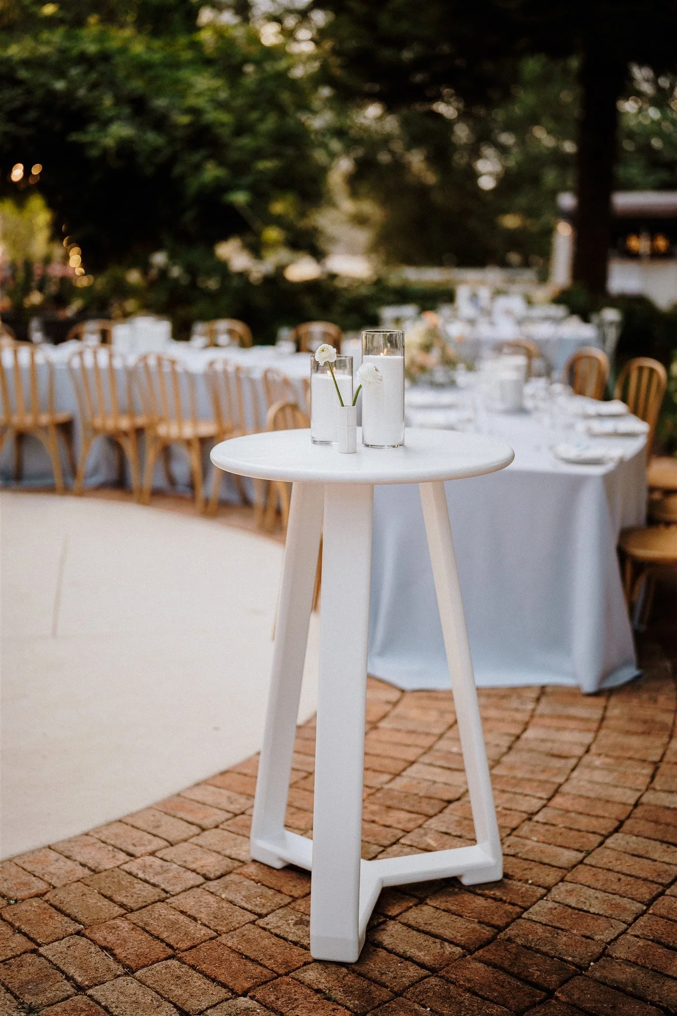 Grace white cocktail table styled for a wedding celebration