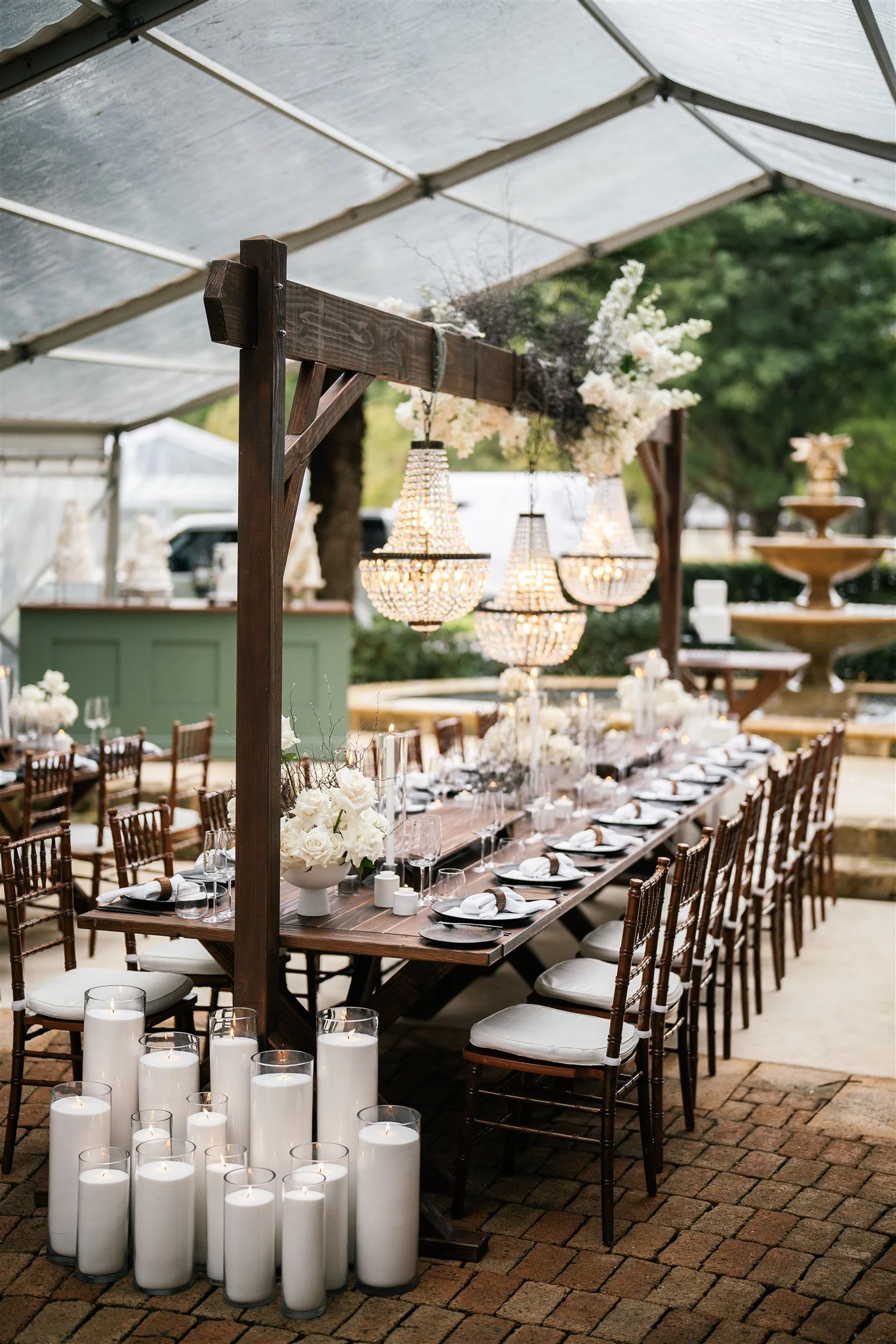 Glamourous white floral and black accent table styling on our walnut wooden tables.