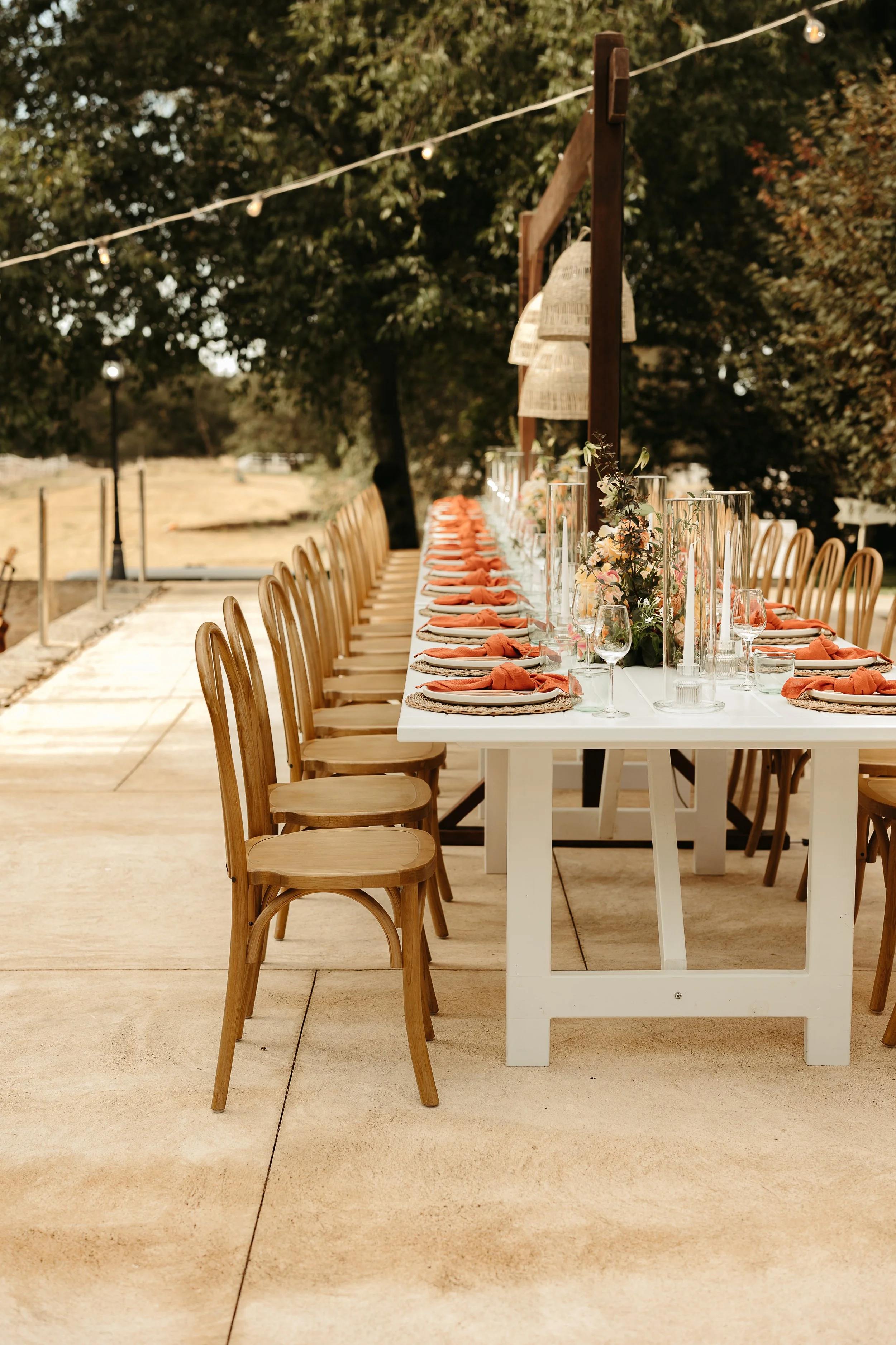 Beryl white dining table set in an outdoor wedding reception