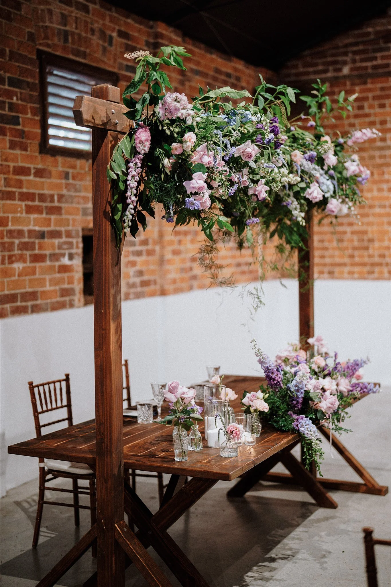 Nikola Estate wedding with Sarah arch over a bridal table
