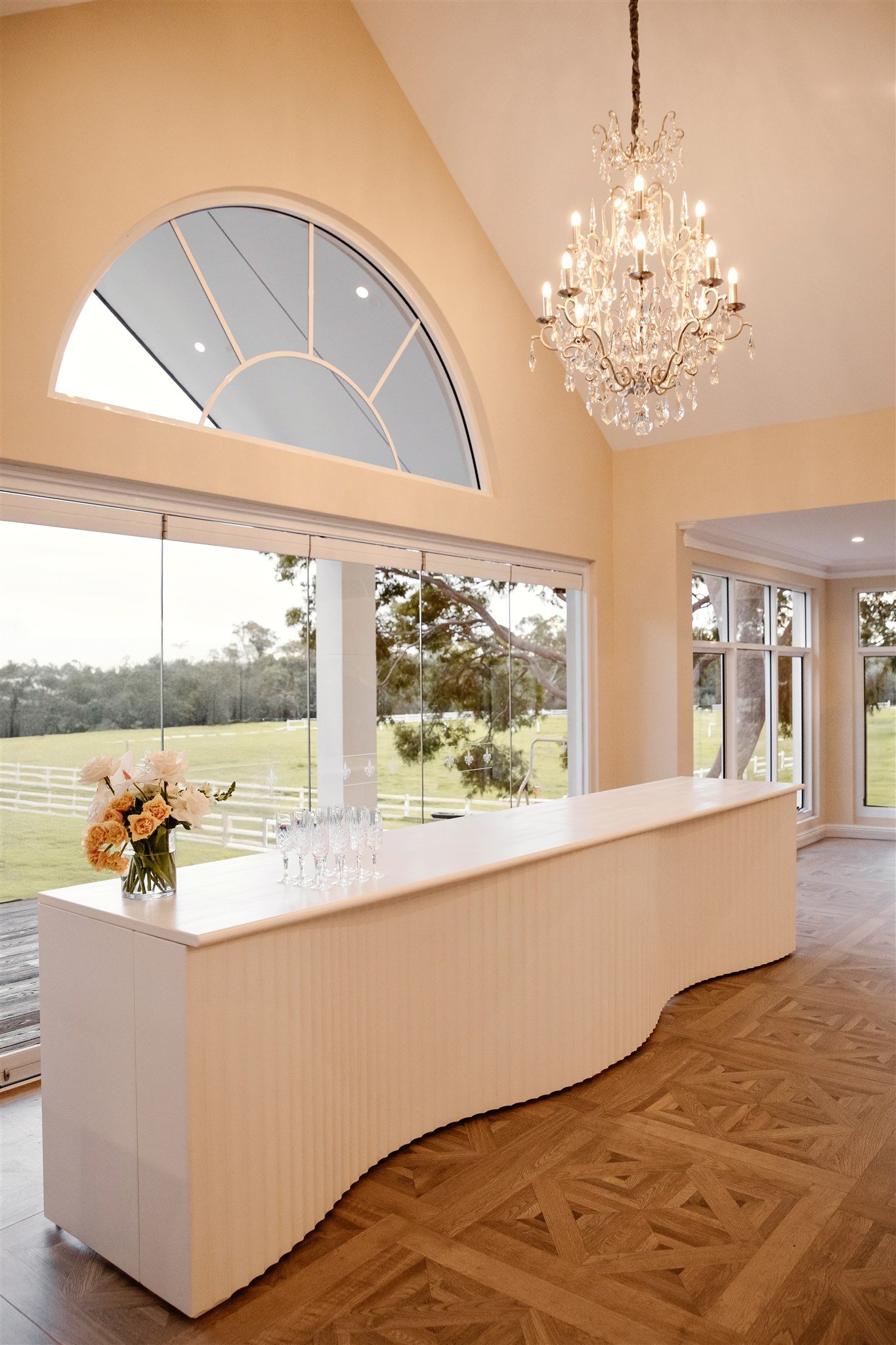 Double Monaco white curved bar at a wedding reception