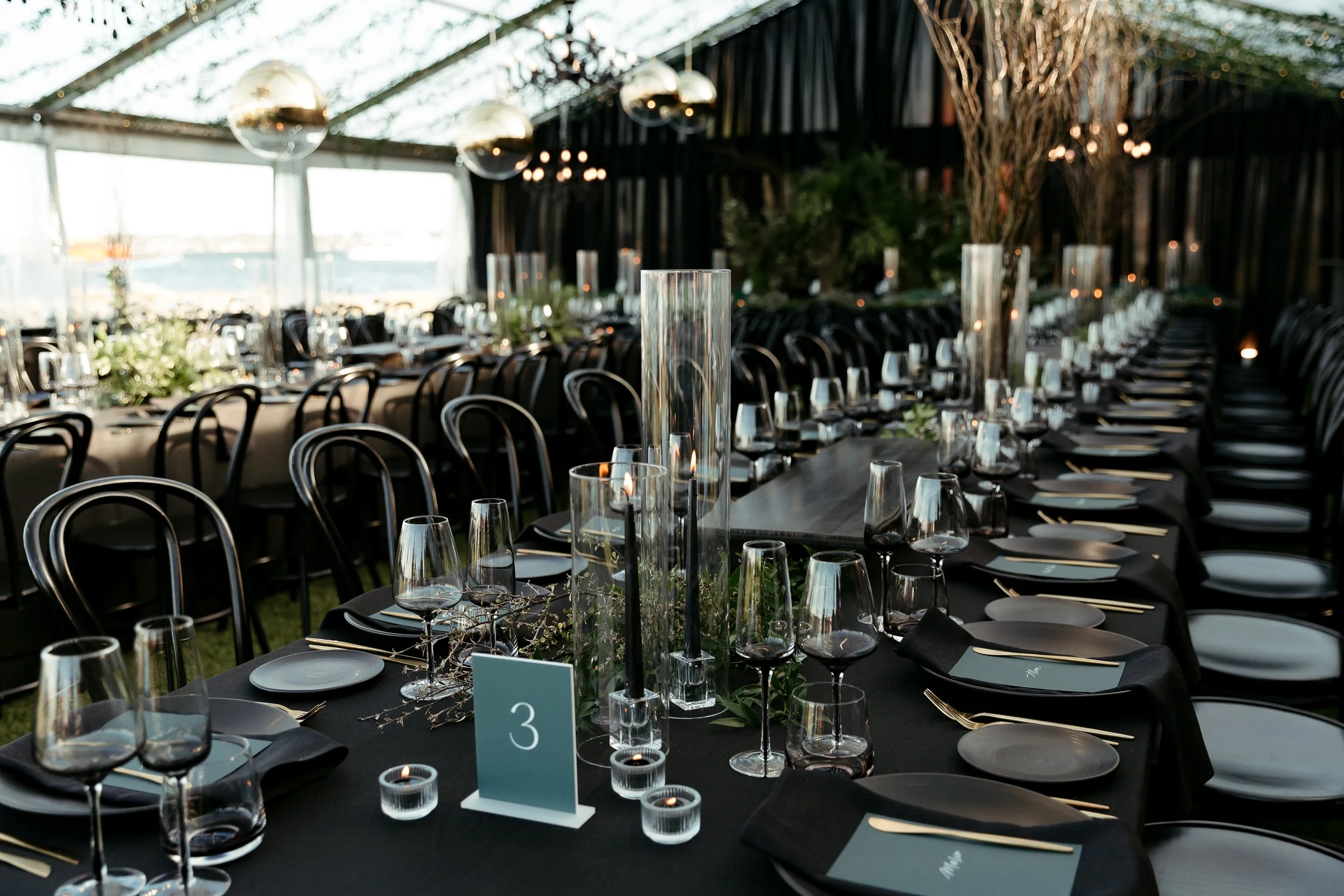 black table raiser on a black designed wedding table
