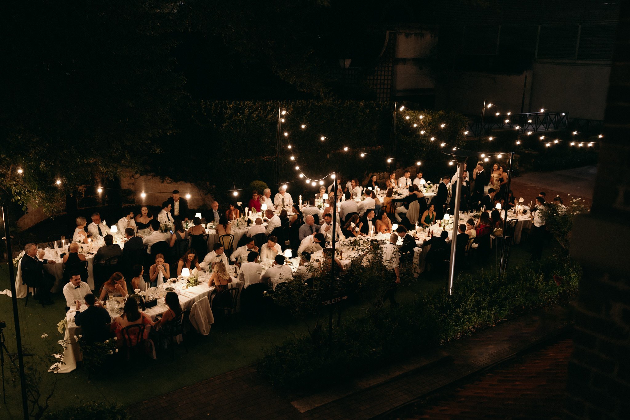 Double Curved Serpentine Wedding Reception in the Evening at Lamont's Bishop House