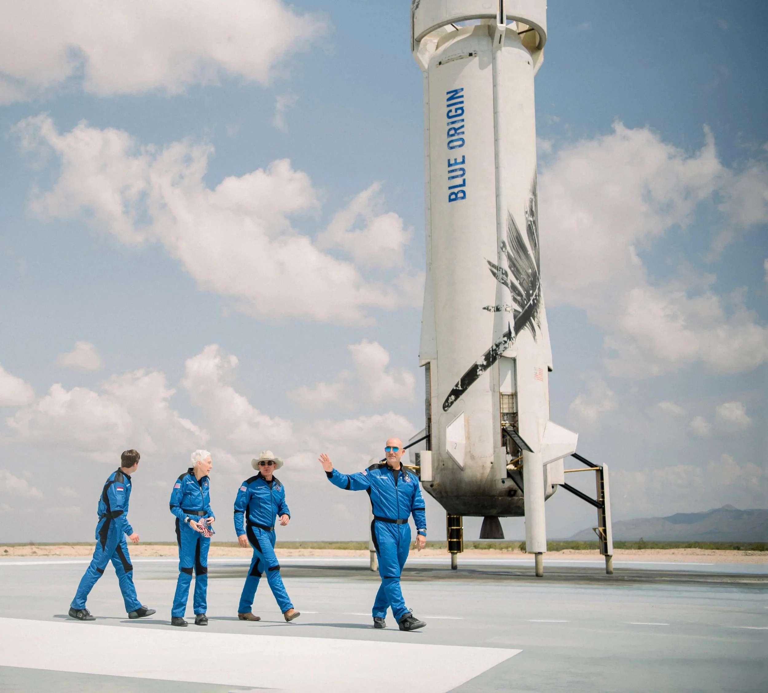 gallery-blue-origin-first-human-flight-l0-crew-landed-booster.jpg