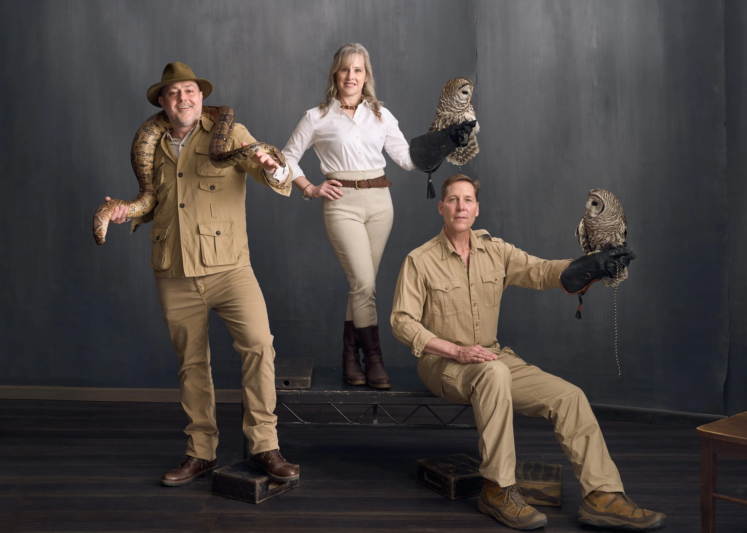Mark Fowler, Chair of the Explorers Club Wildlife Committee, with Carolyn Rinaldi and Jim Knox from the Beardsley Zoo, posing with a Boa Constrictor and Barred Owls