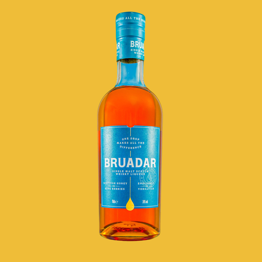 Bottle of Bruadar single malt Scotch whisky with an orange liquid inside, blue label, and blue cap, against a yellow background.