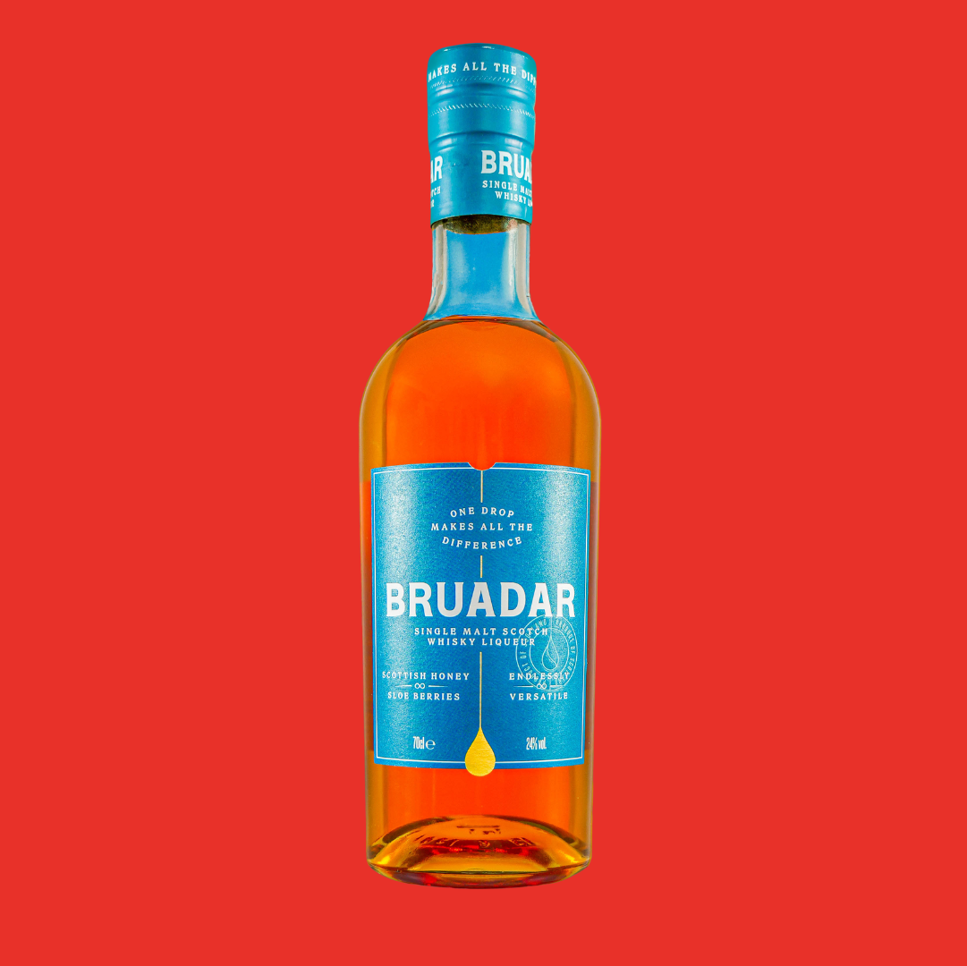 Bottle of Bruadar single malt Scotch whisky against a red background.