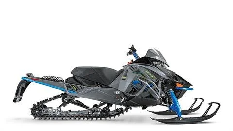 A black and blue snowmobile with a windshield, running on a white background.