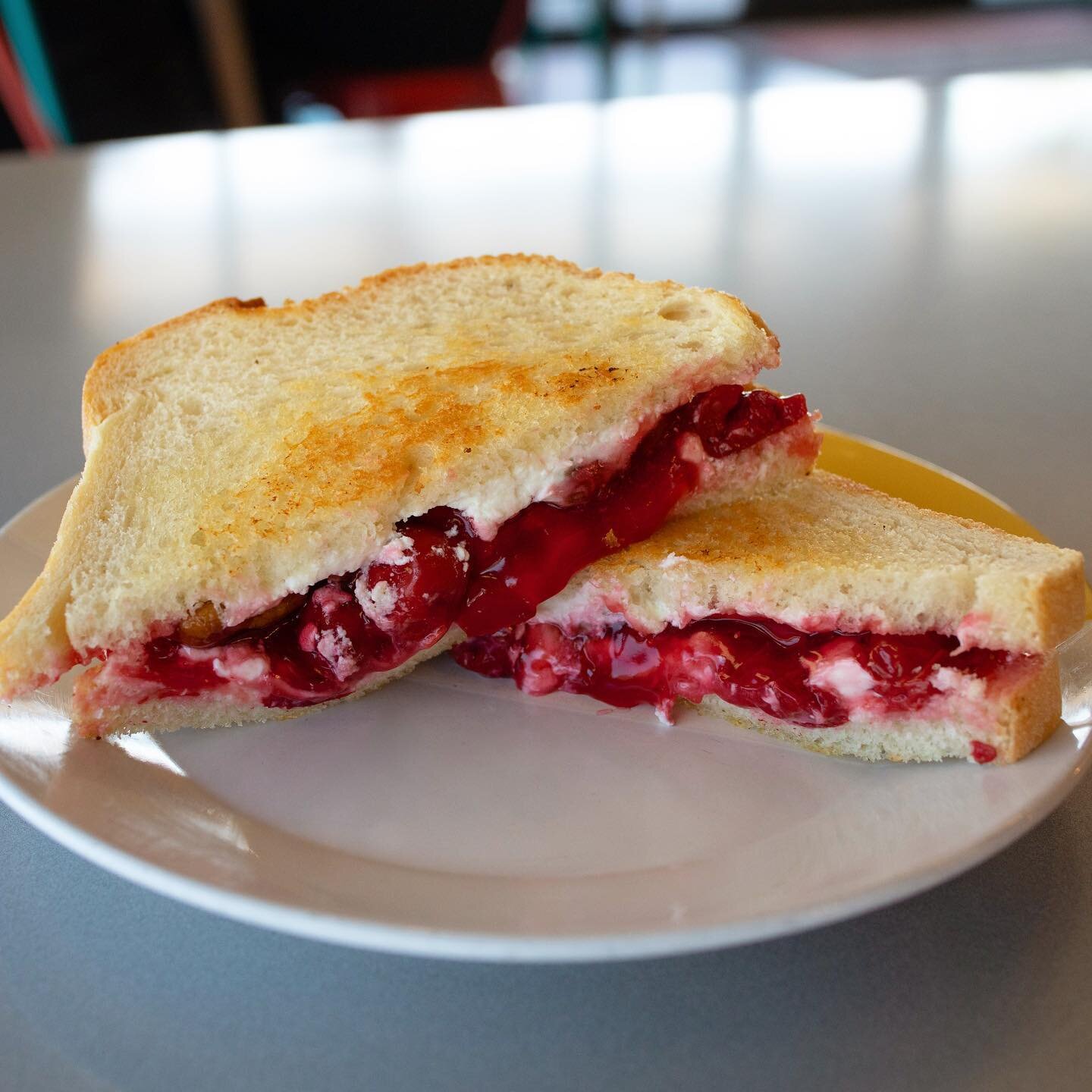 Hello Daddy, Hello Mom. I&rsquo;m your Ch-ch-ch-cherry bomb! 
This months special is one of our favorites and we know you&rsquo;ll love it too! 
The Cherry Bomb has ch&egrave;vre cheese, cherry pie filling, and candied pecans melted onto white bread!