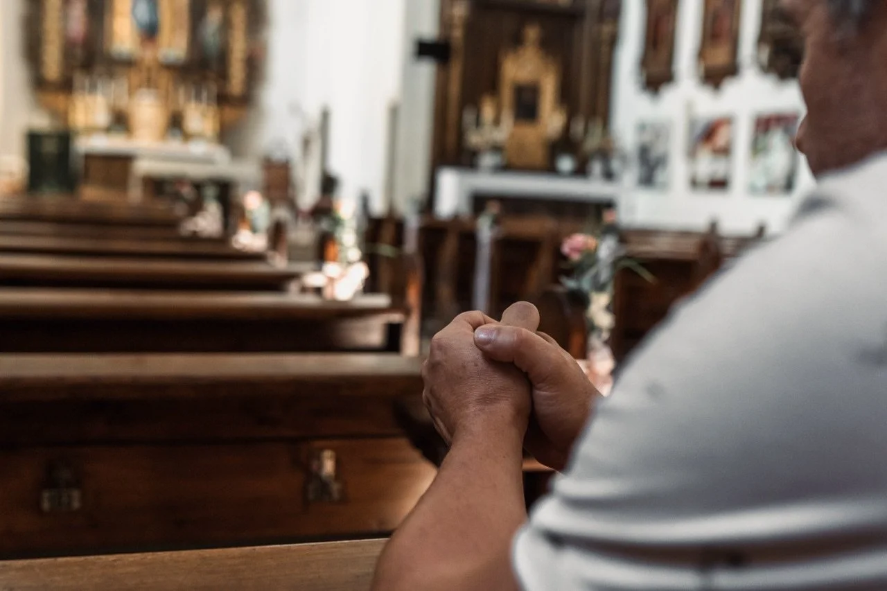 man-praying-in-church-2023-11-27-05-09-13-utc.jpg
