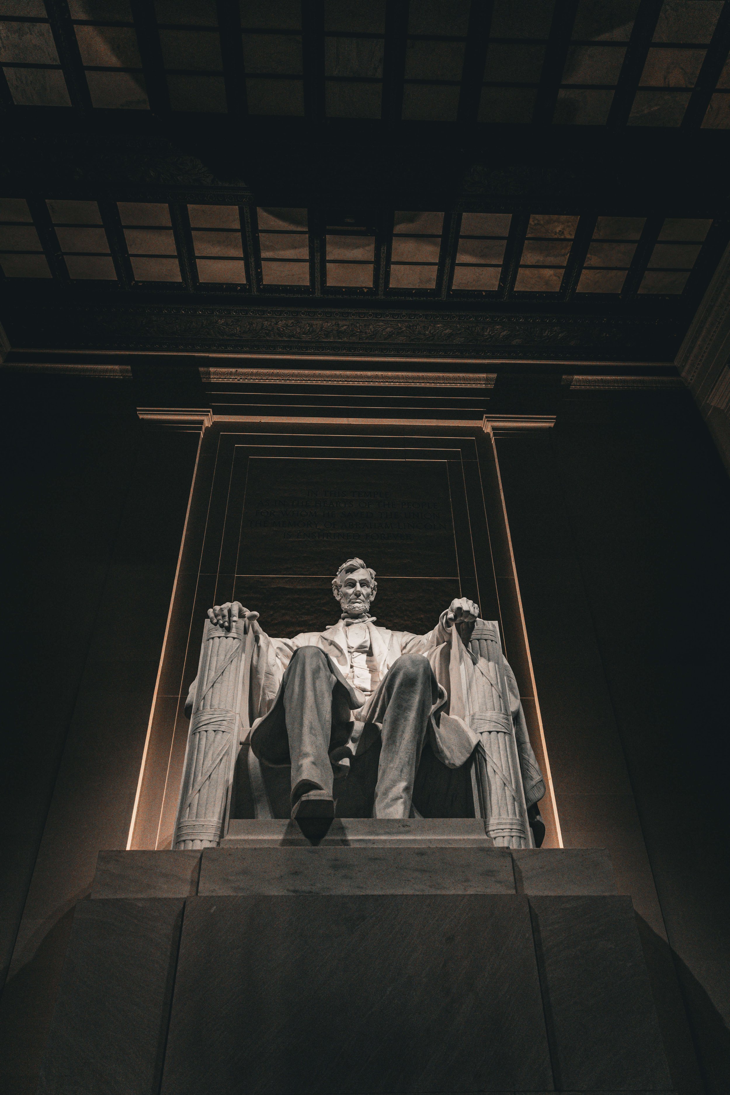 The Lincoln Memorial statue of Abraham Lincoln in Washington, D.C., with statue prominently displayed in the center and the ceiling visible above.