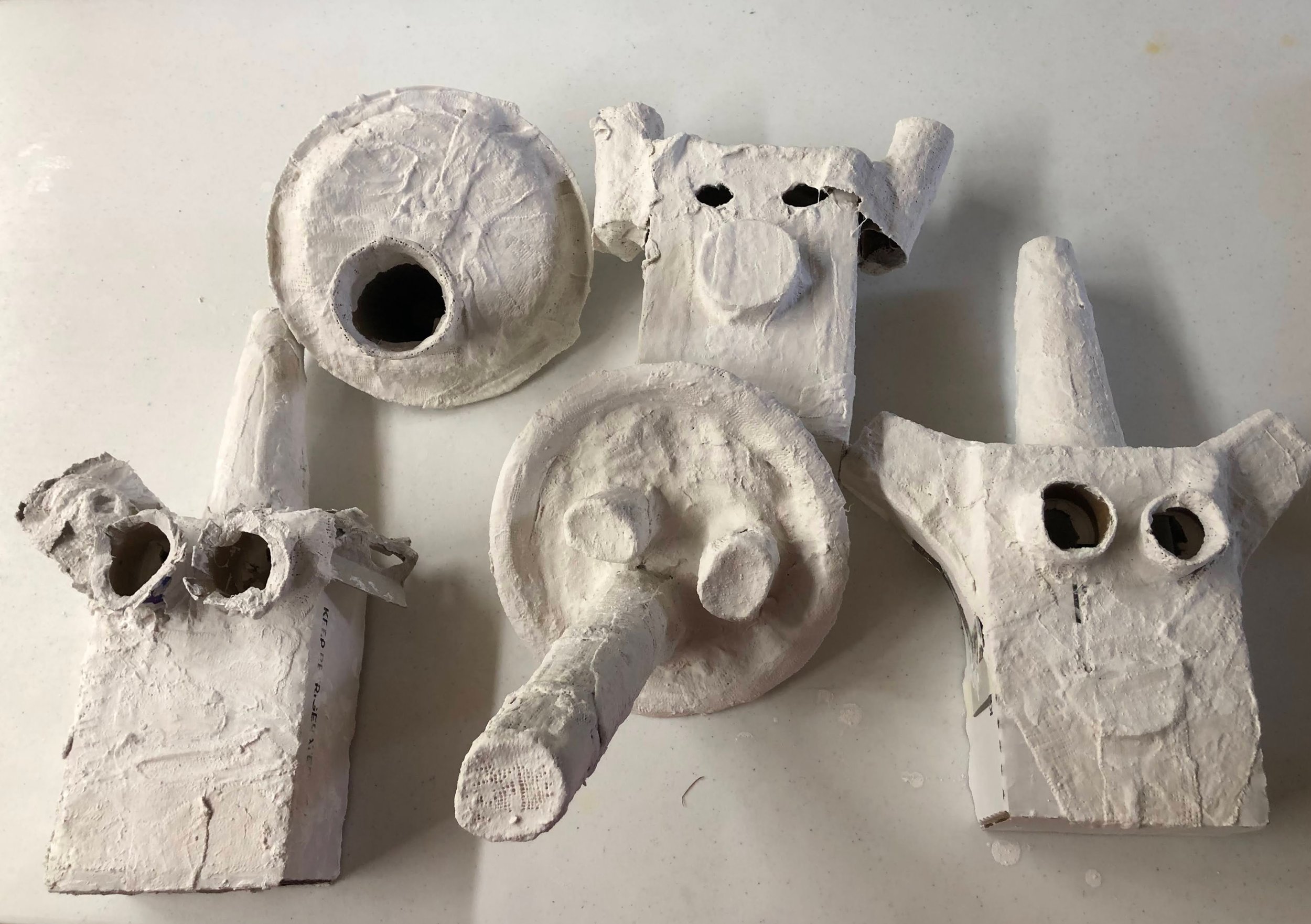 Plaster masks inspired by various African Masks