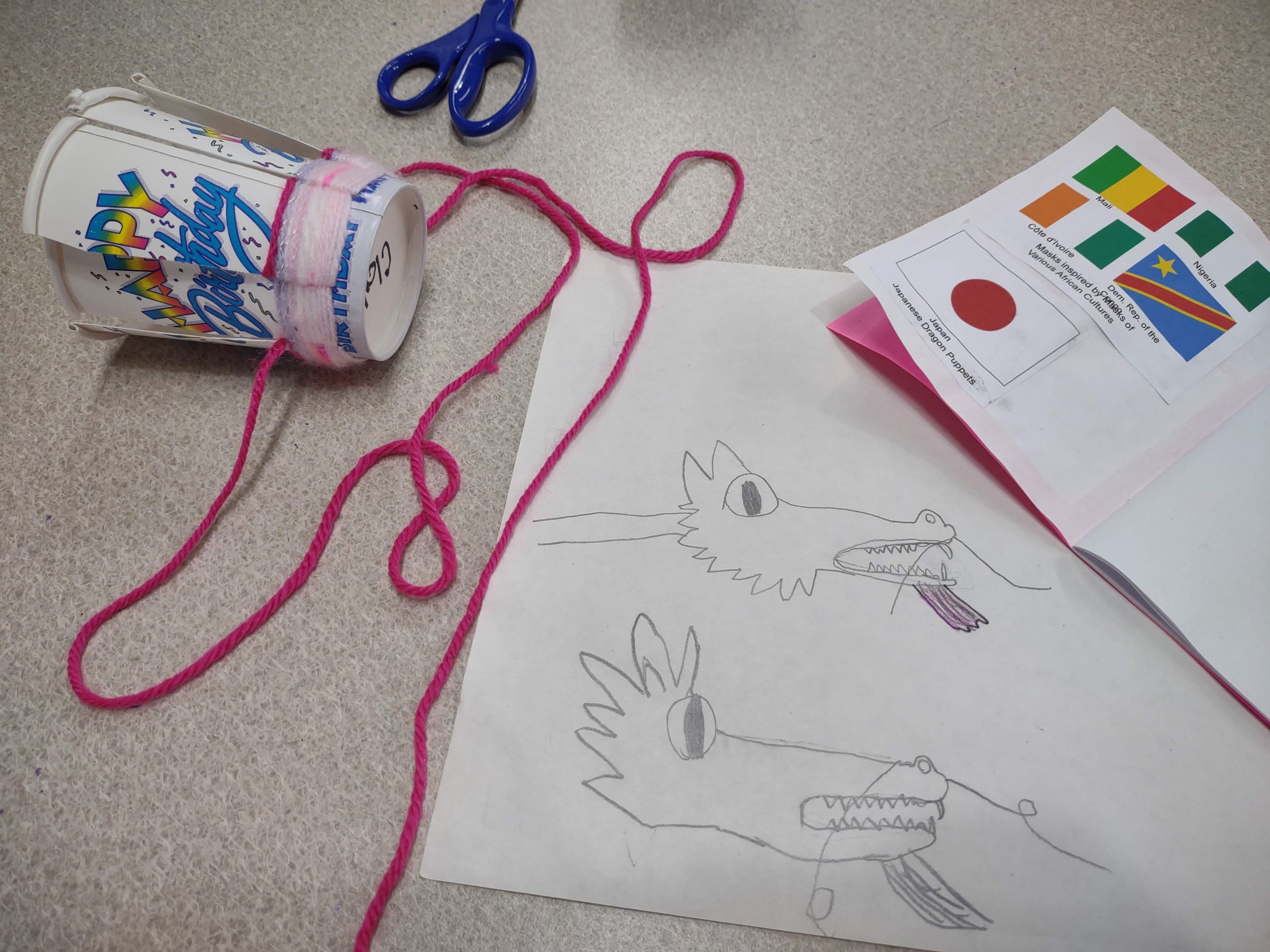 Practicing drawing Japanese Dragons, passport, and Zulu inspired weaving